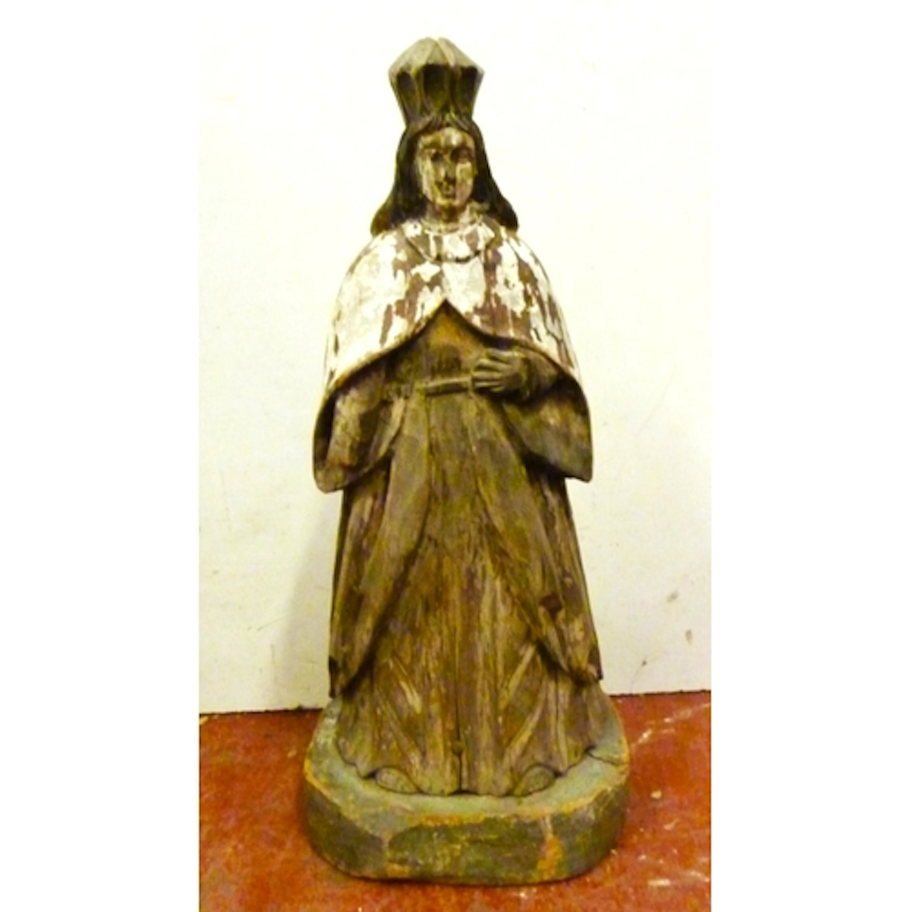 Polychrome on wood carved religious sculpture modelled as an...