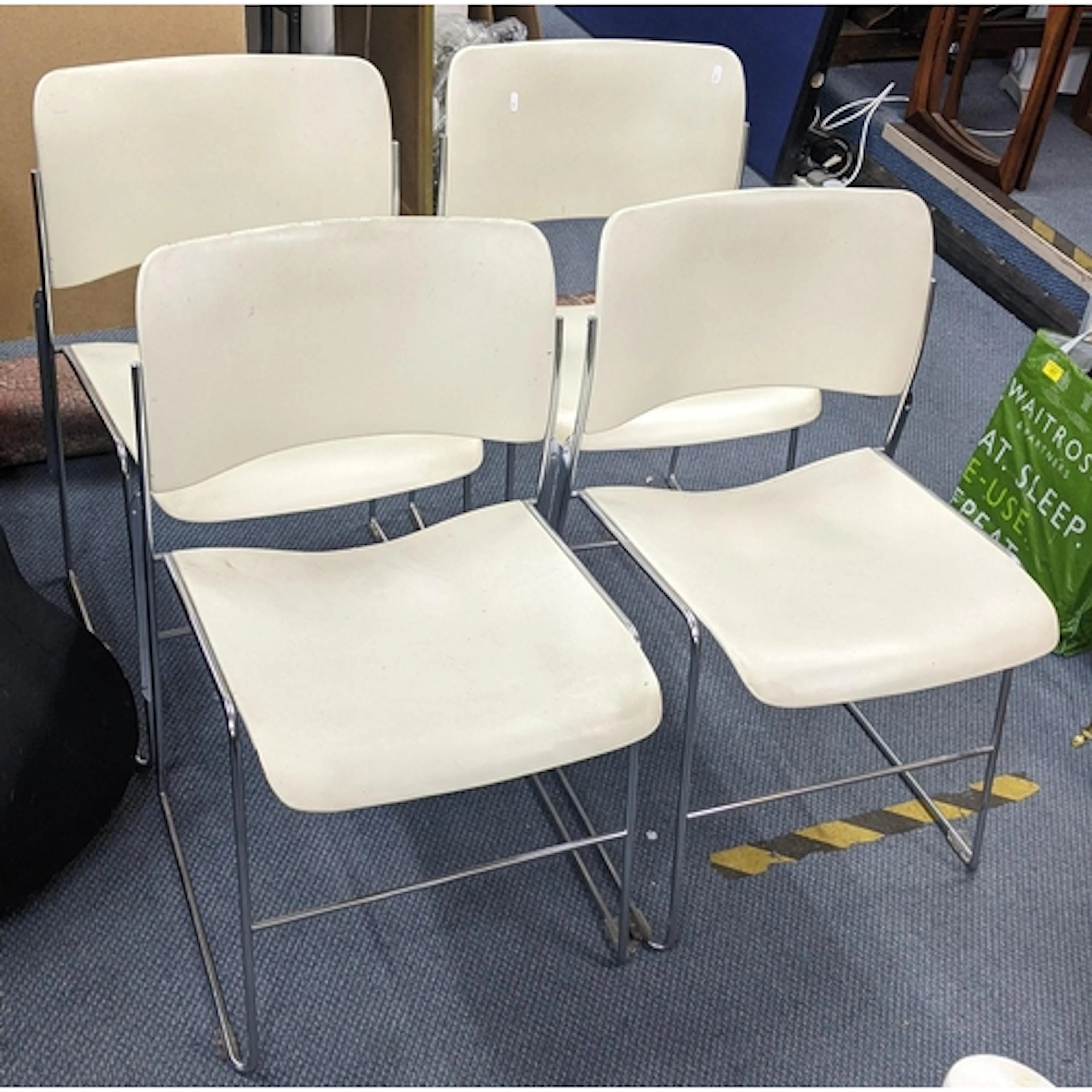 A set of four mid 20th century 40/4 stacking chairs designed...