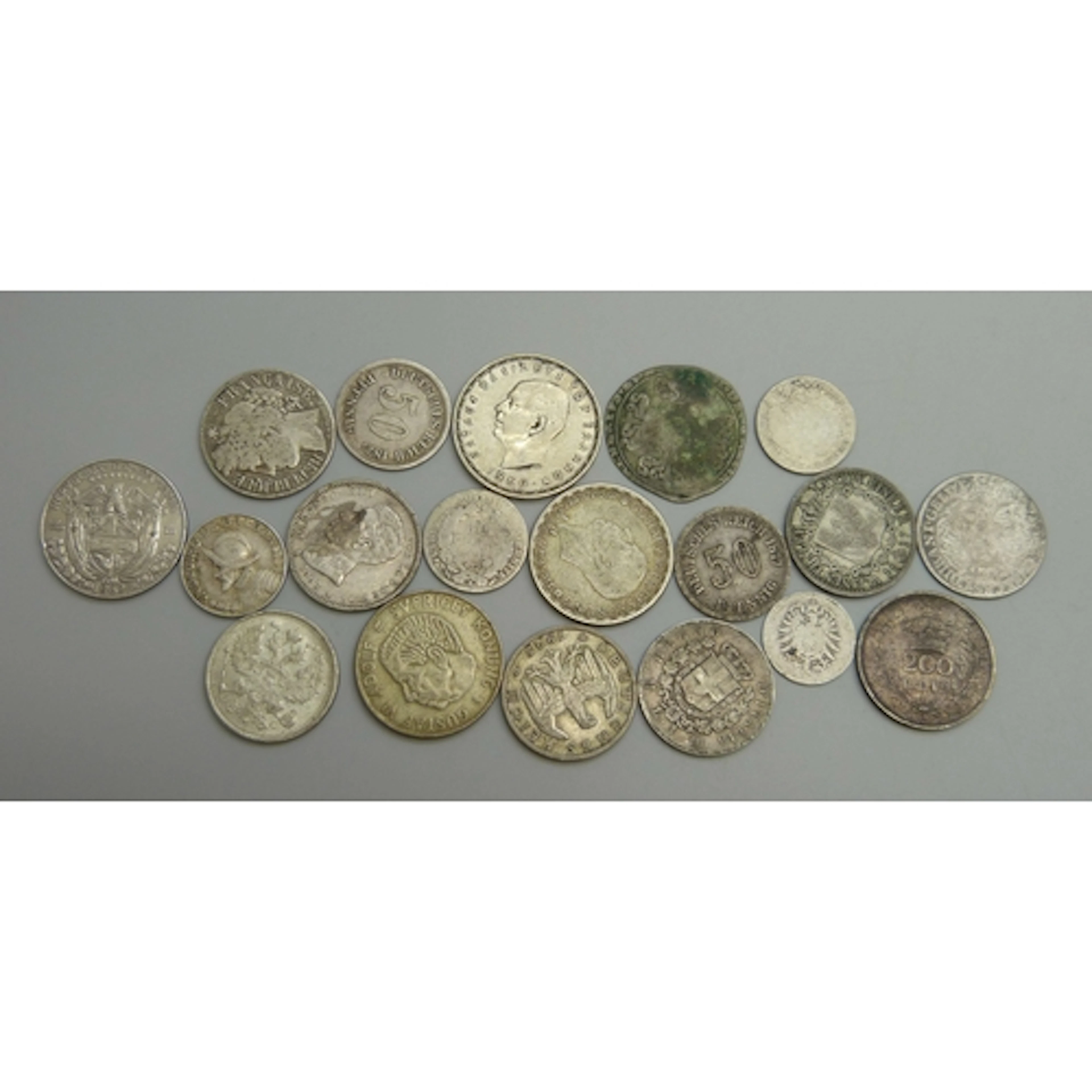 A collection of world coins including France, Panama, German...