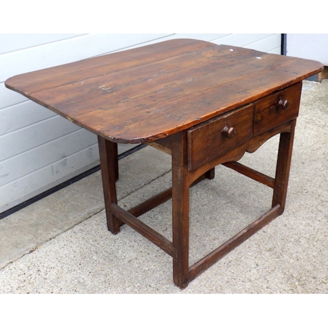 A two drawer oak side table with drop leaf at the back, 110c...