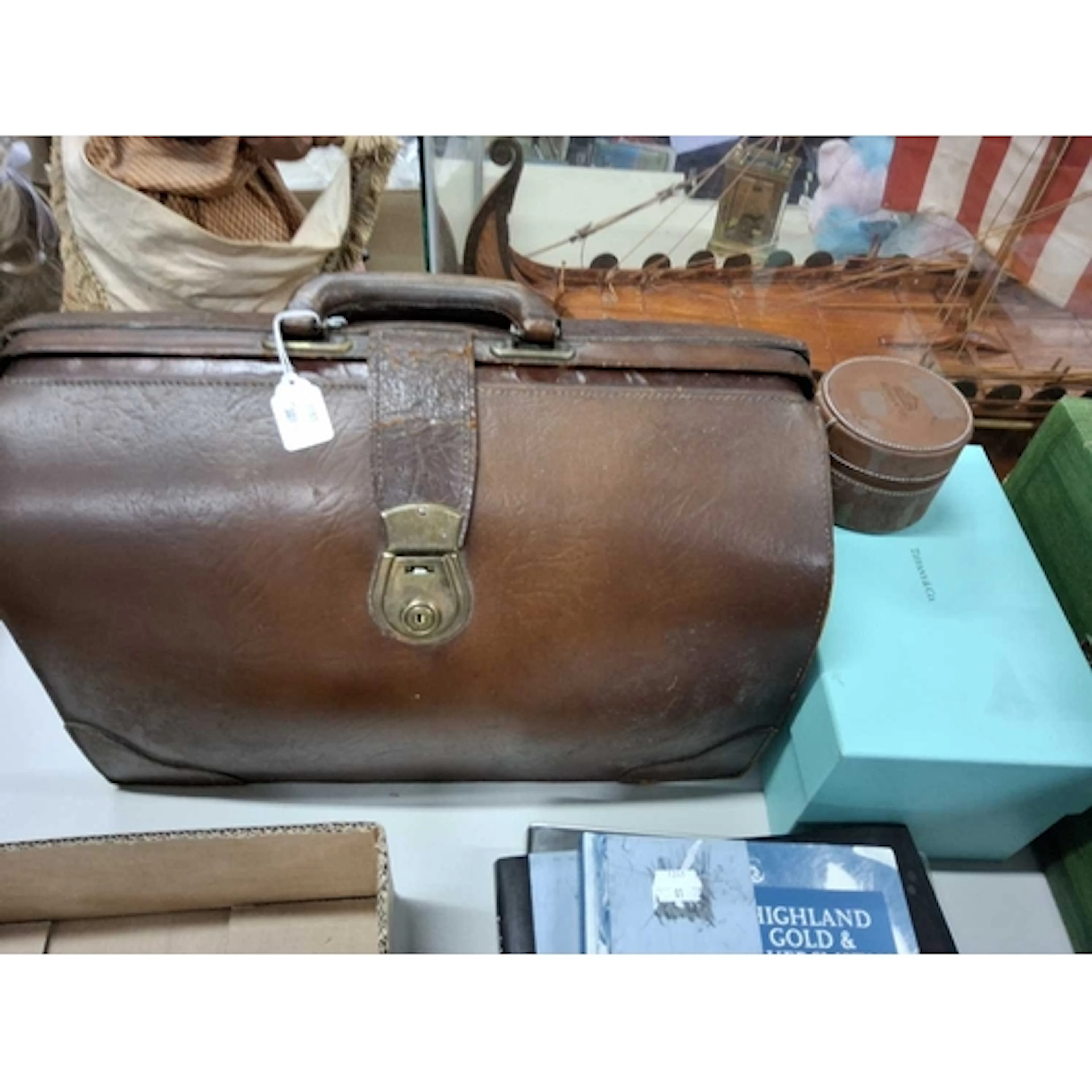 A VINTAGE LEATHER GLADSTONE DOCTOR'S BAG together with an em...