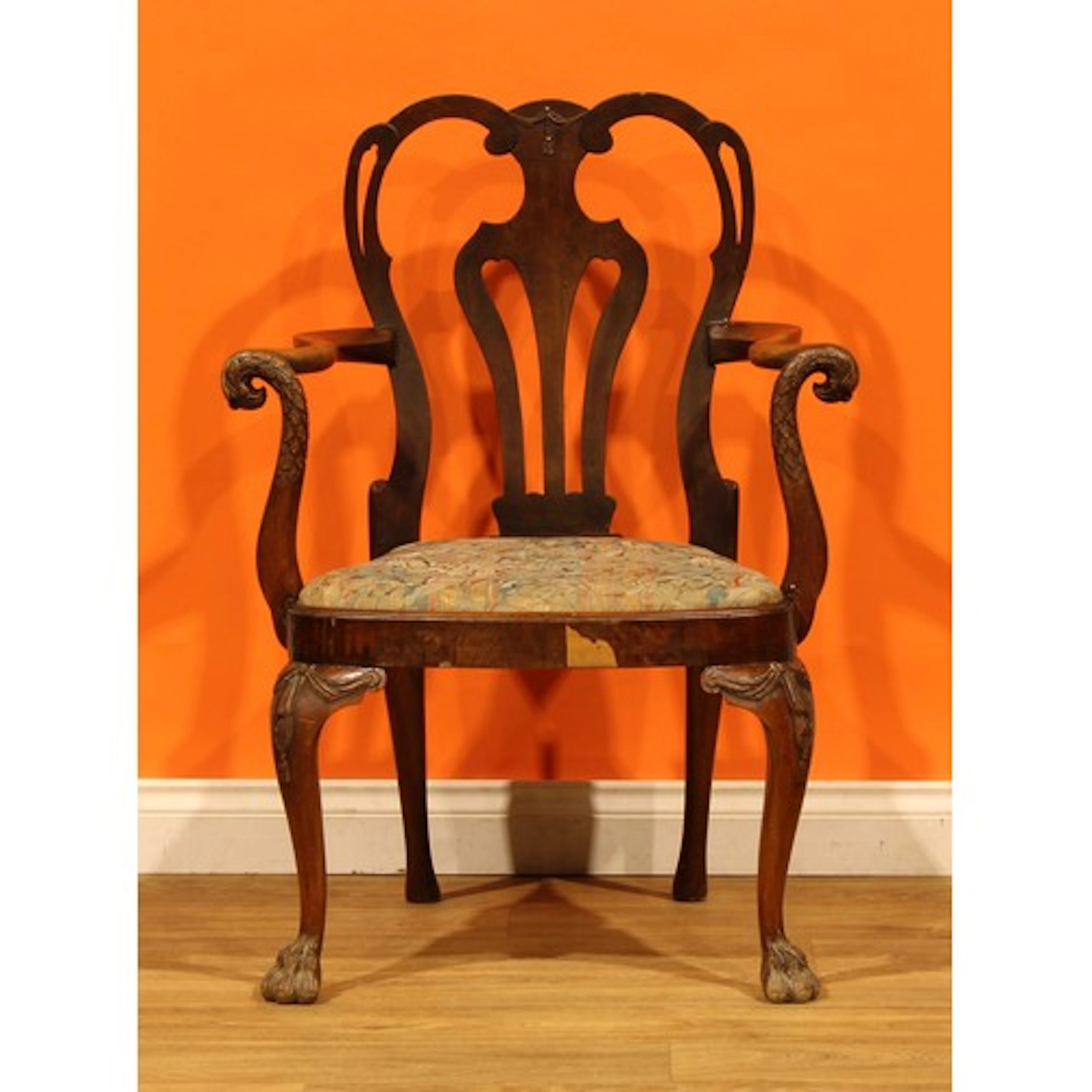 A George II Revival walnut elbow or desk chair, pierced vasu...