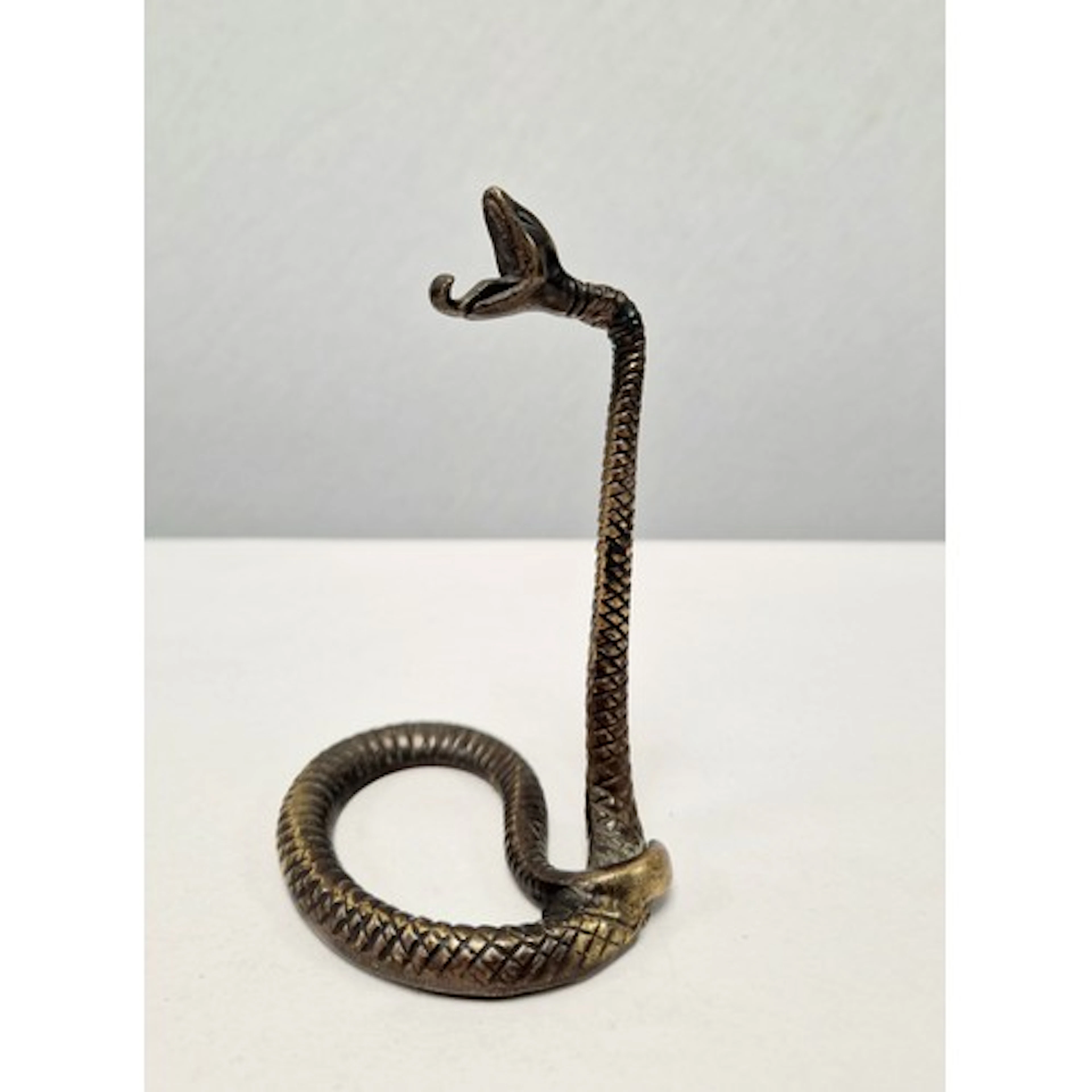 Brass pocket watch holder in the form of a snake