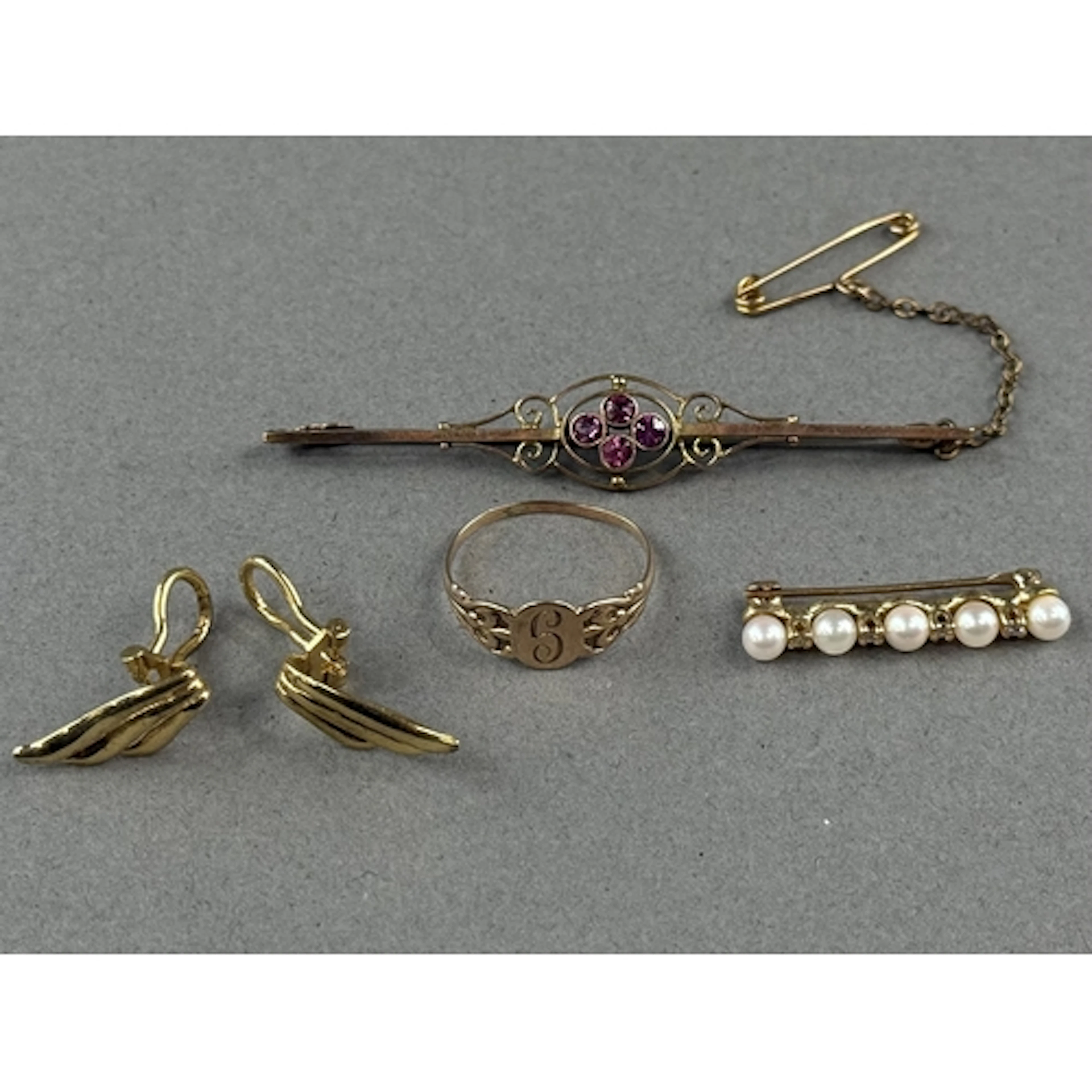 Jewellery: a pair of 9ct yellow gold clip on earrings in the...