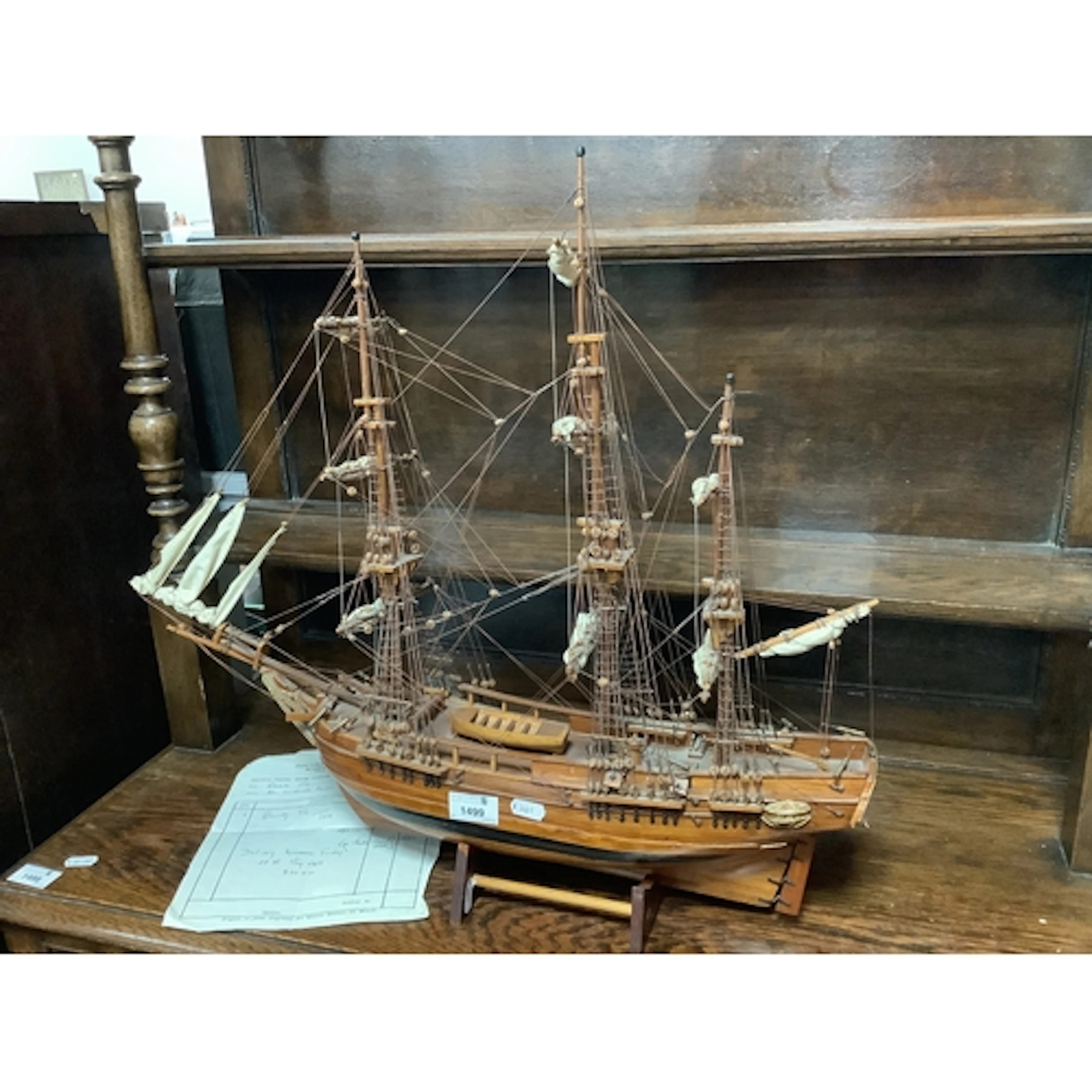 A Vintage HMS Bounty 1988 Teak Ship Model, featuring plank-o...