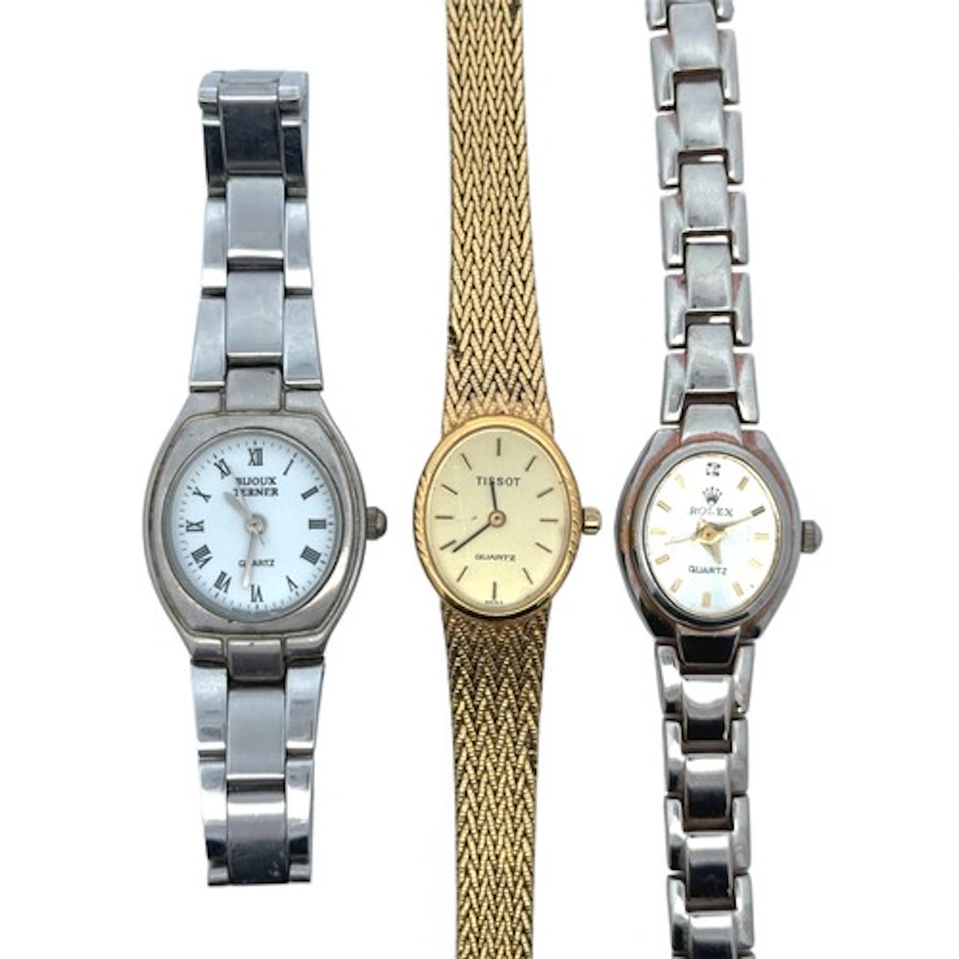 Three quartz watches. A Tissot ladies gold-plated watch, a B...