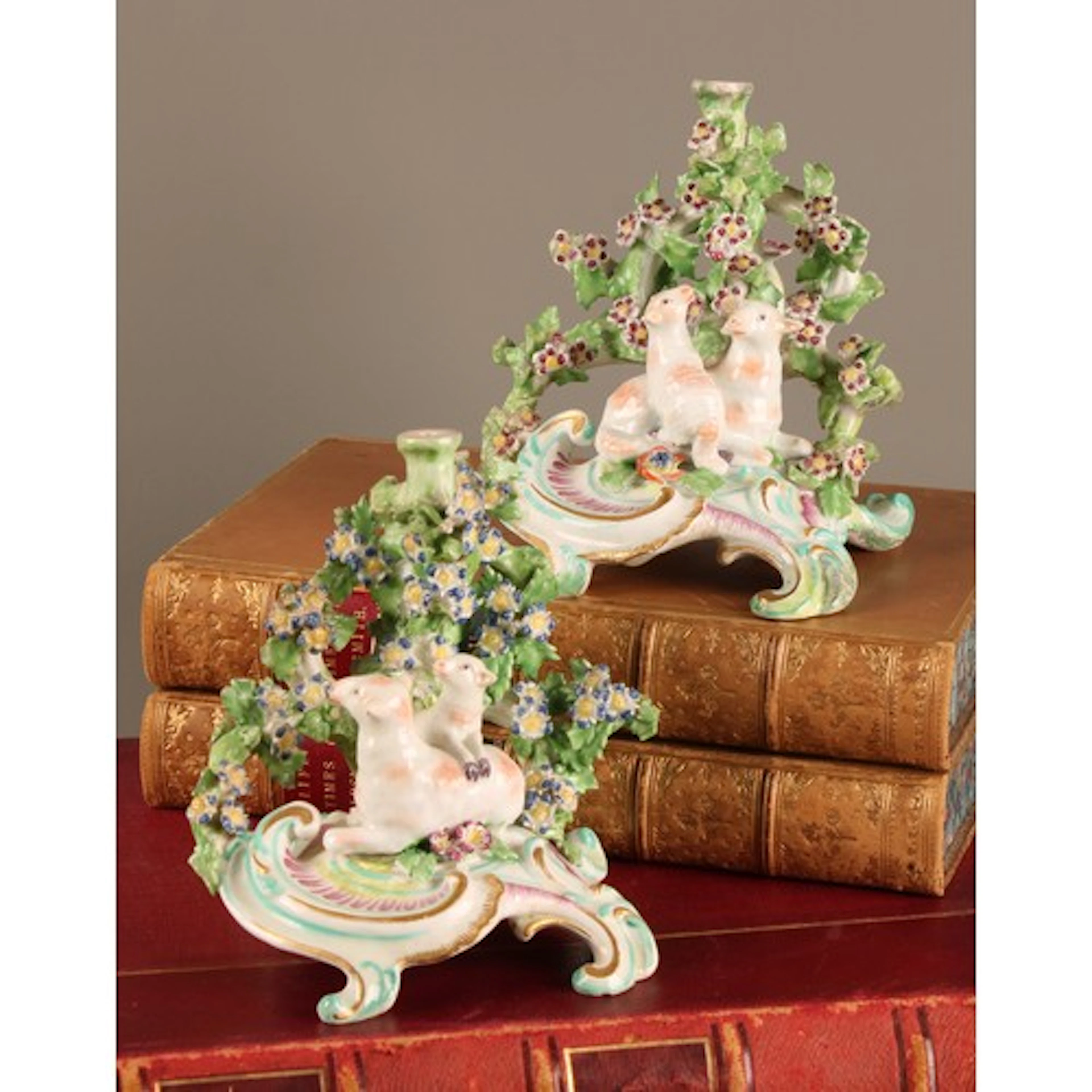 A pair of 18th century porcelain chamber sticks, possibly Bo...