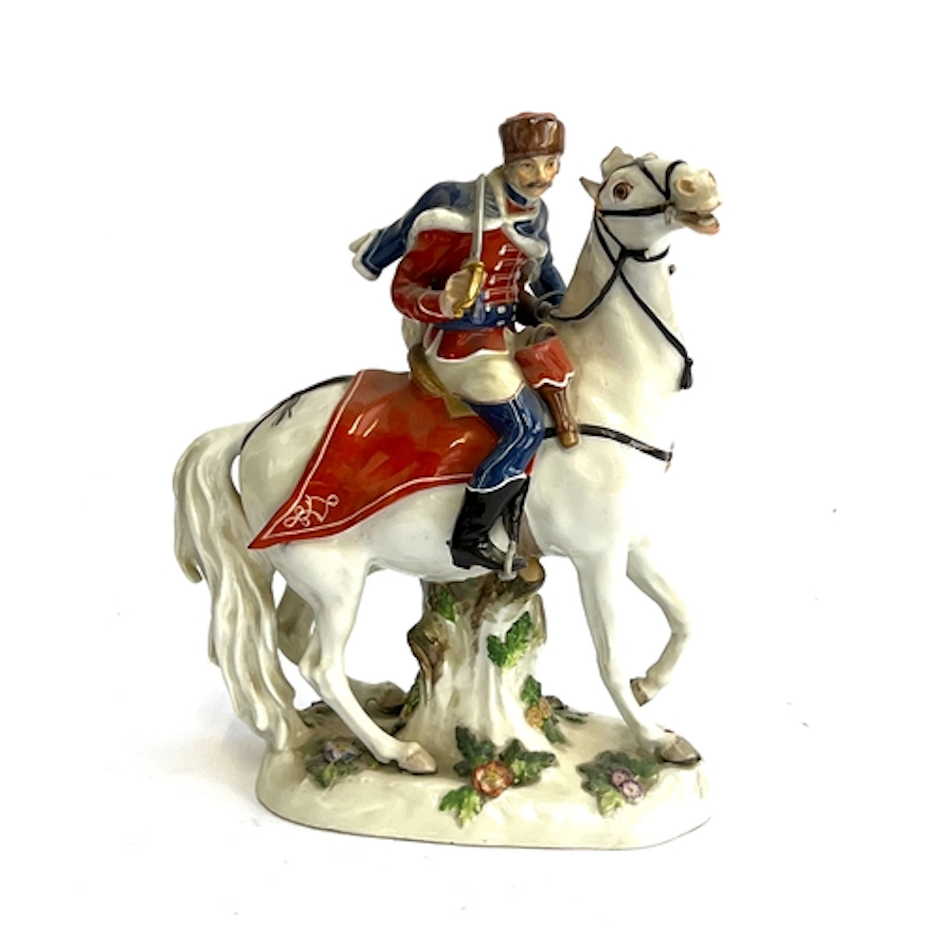 A Continental Meissen style porcelain figure of a Hussar (af...