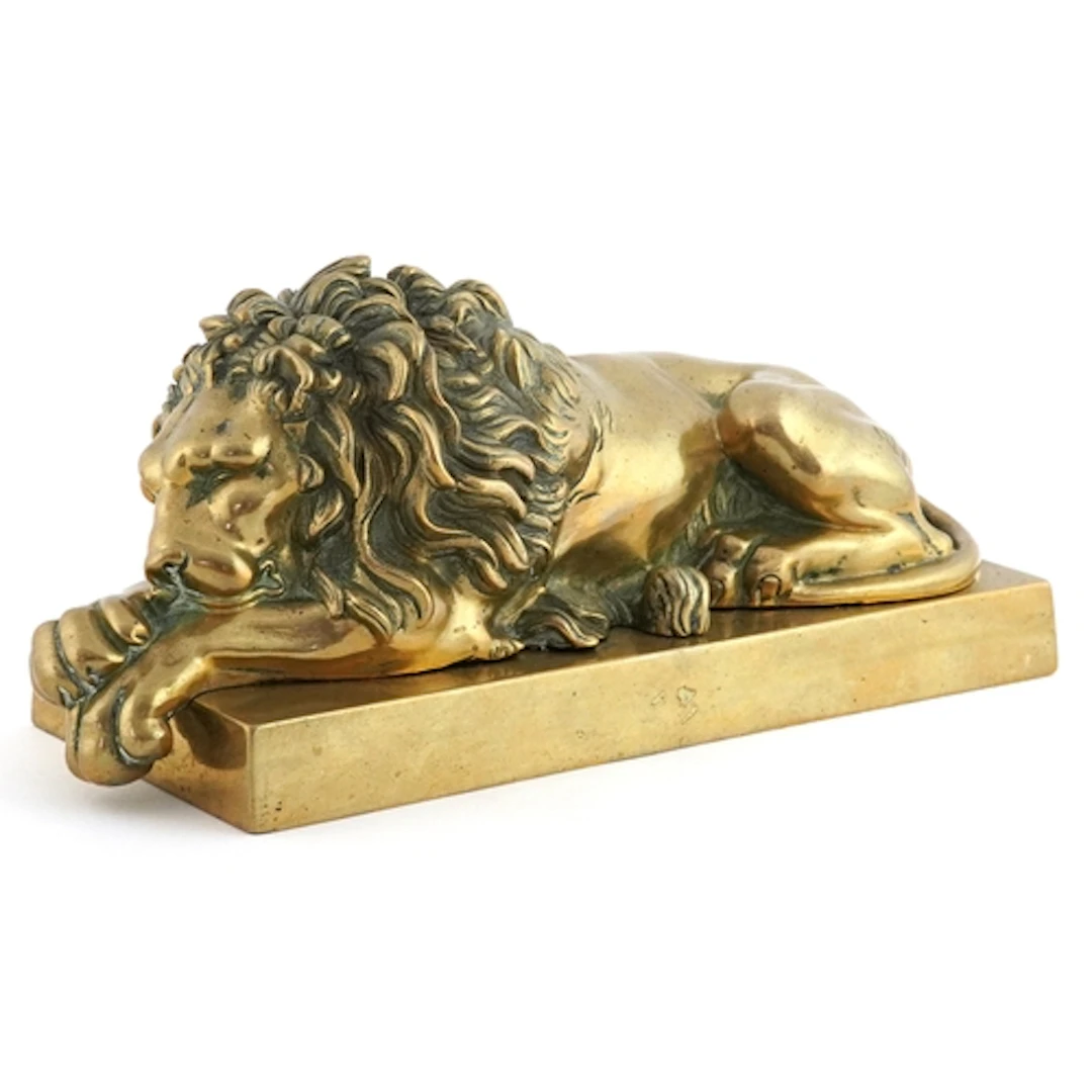 Grand Tour style gilt bronze study of a recumbent lion, 22cm...