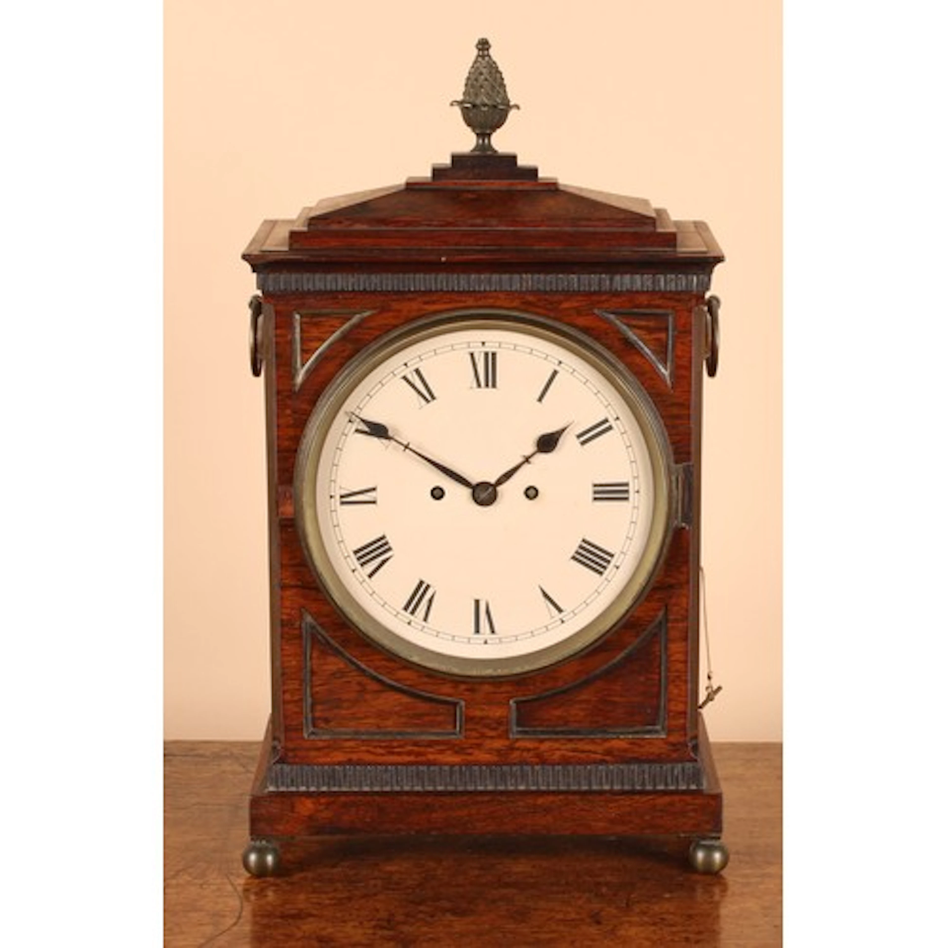 A post-Regency rosewood table or bracket clock, later 20cm d...