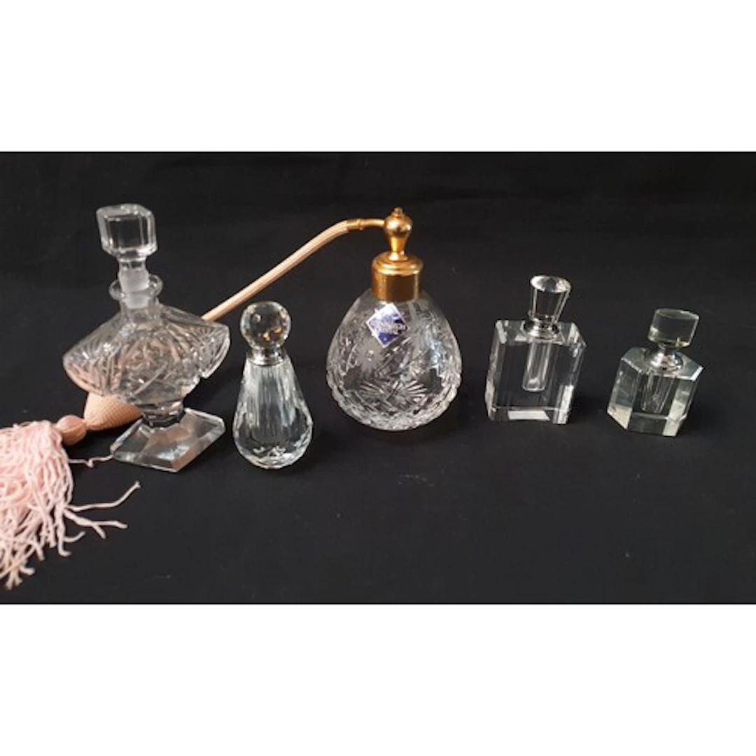 FIVE GLASS SCENT BOTTLES in various shapes and sizes, one ma...