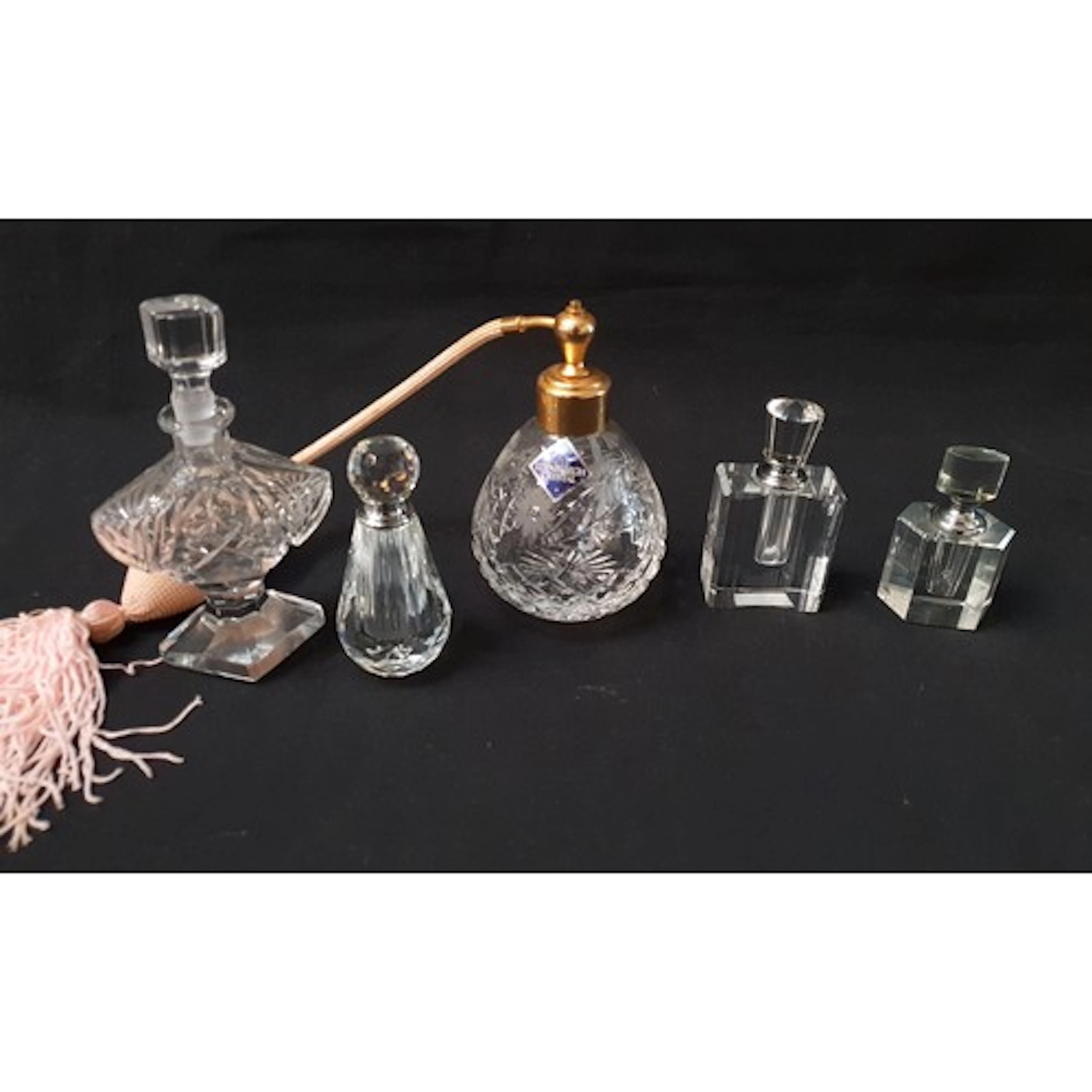 FIVE GLASS SCENT BOTTLES in various shapes and sizes, one ma...