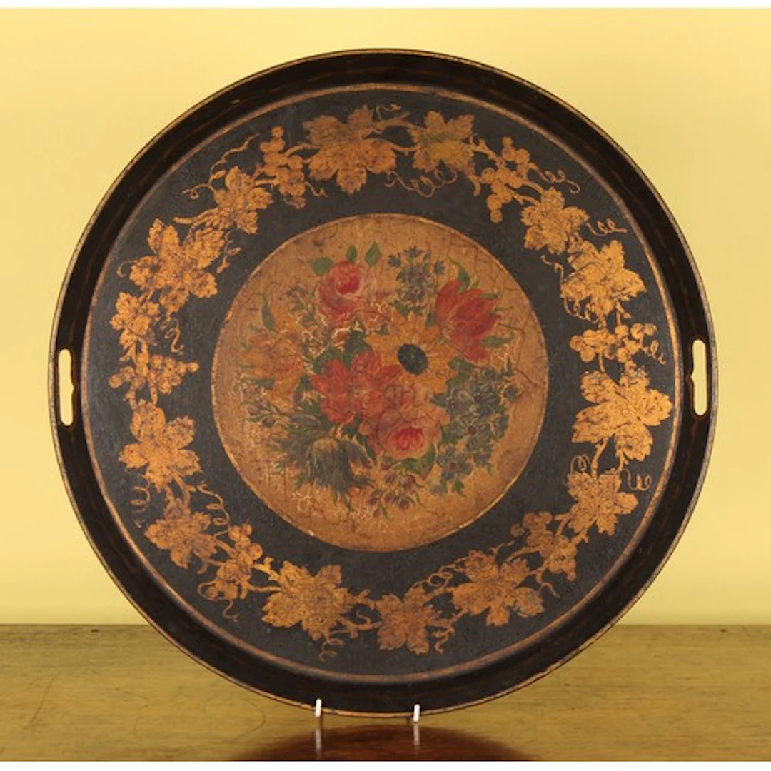 A 19th century toleware circular gallery tray, painted with ...