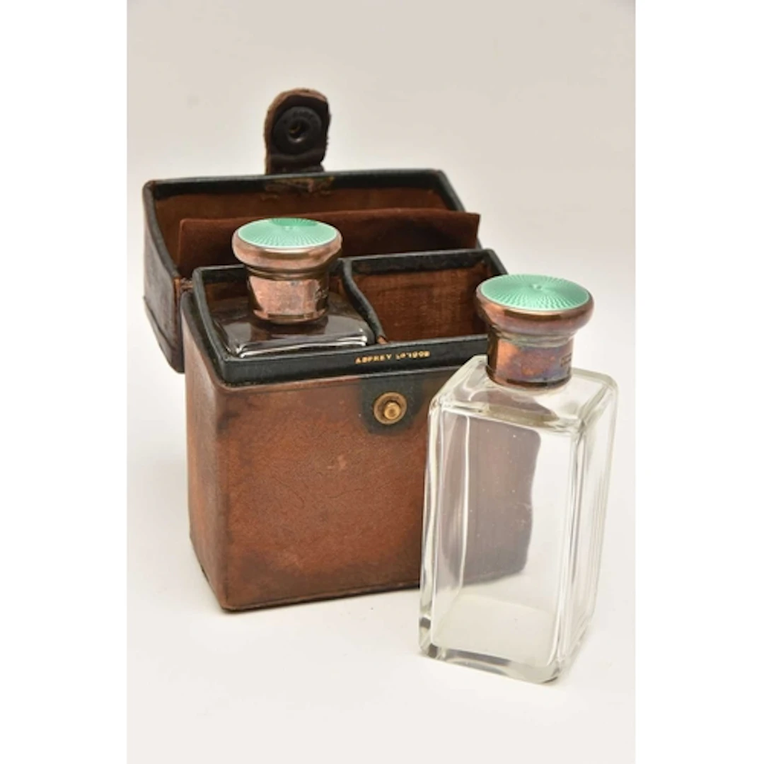 AN EARLY 20TH CENTURY 'ASPREY & CO' TRAVEL PERFUME BOTTL...
