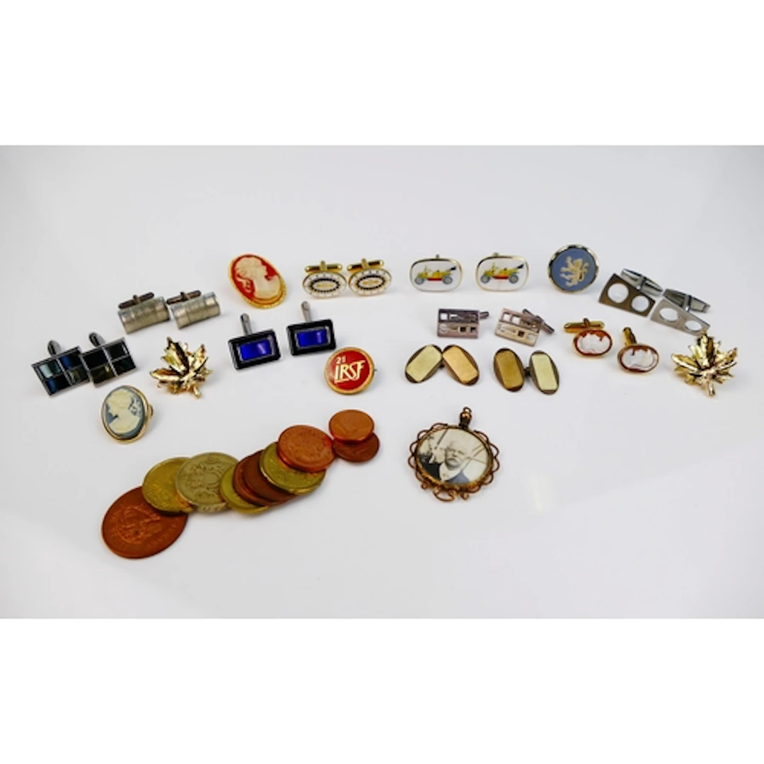 A small selection of costume jewellery including cufflinks, ...