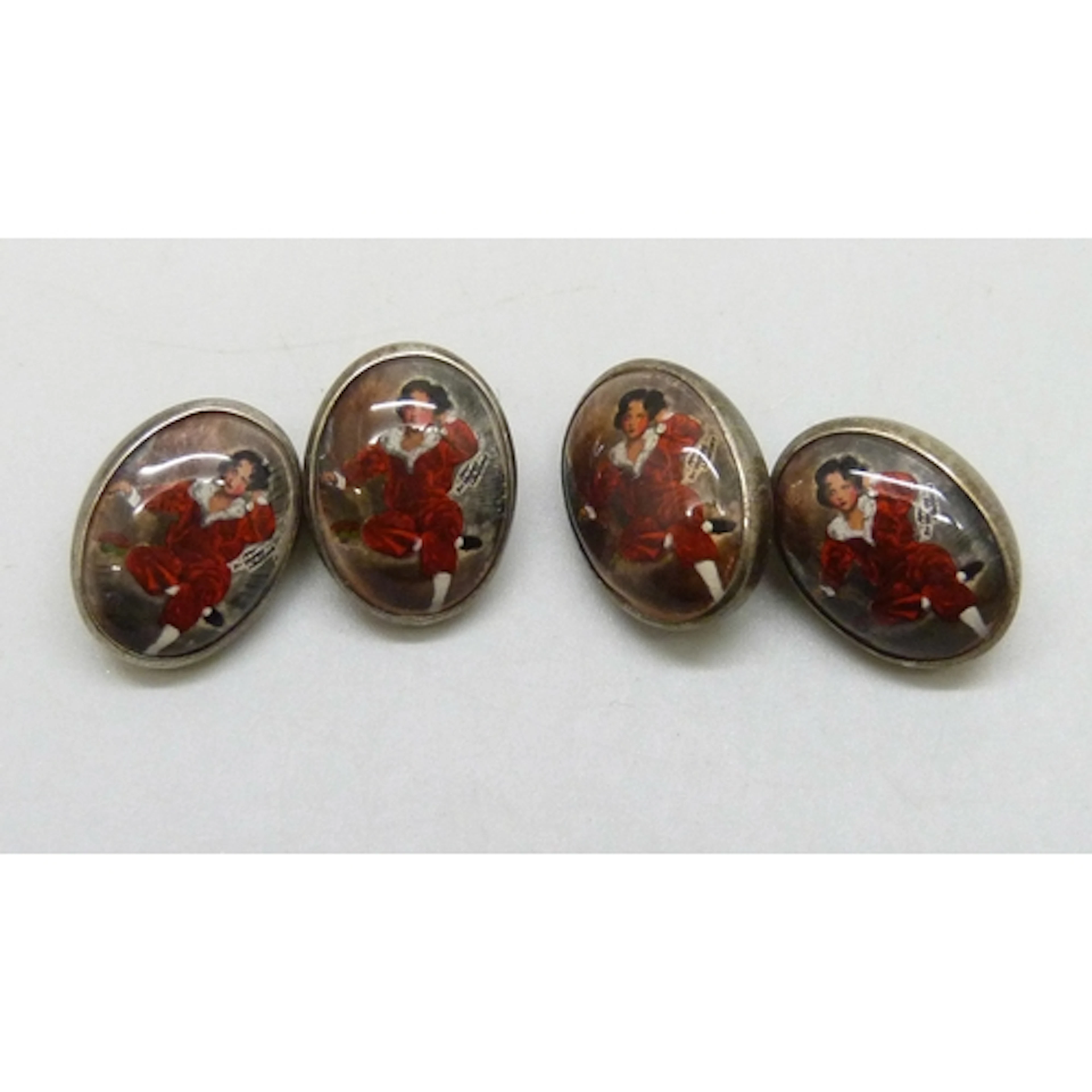 A pair of silver cufflinks depicting The Red Boy portrait by...