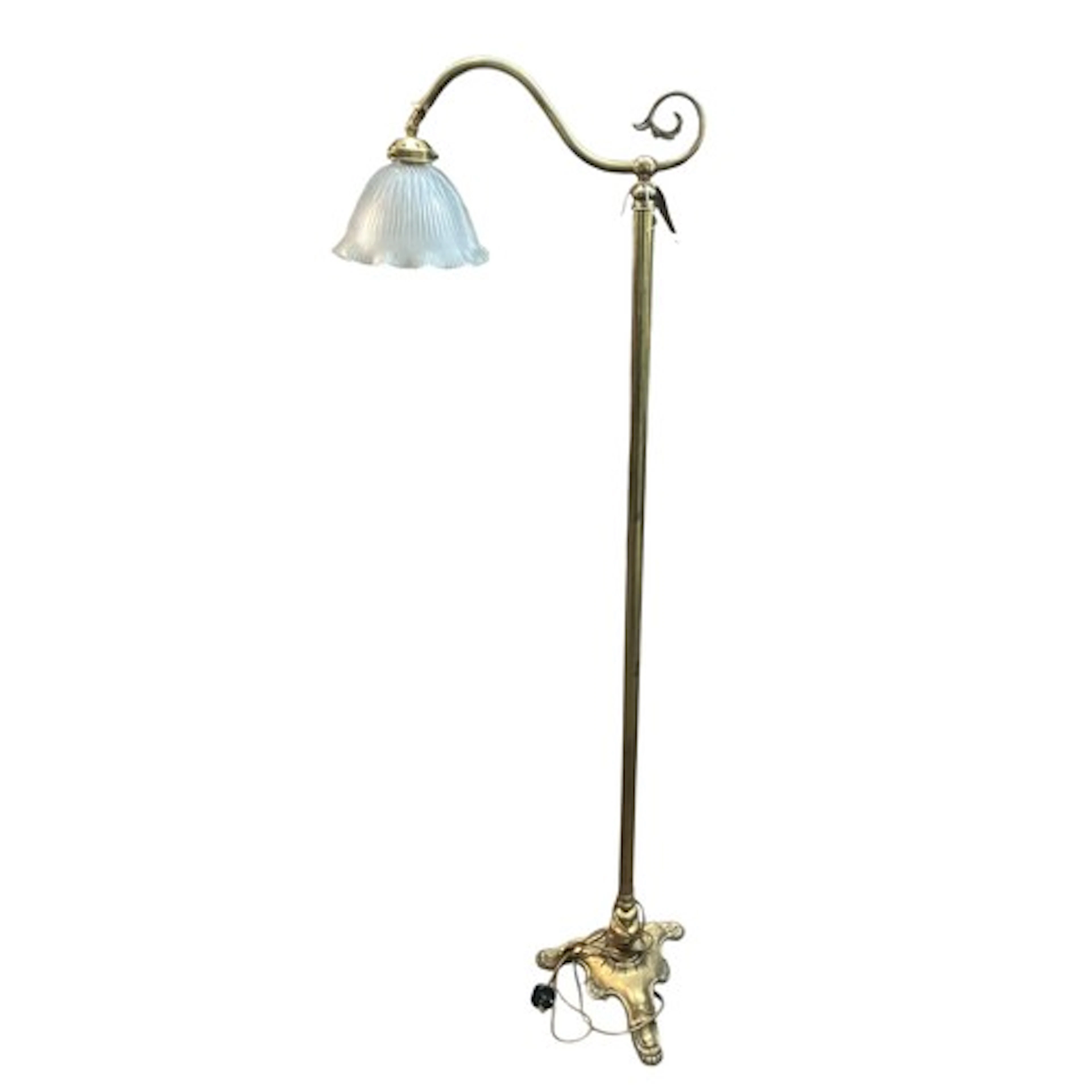 Brass floor lamp with frilled glass shade.