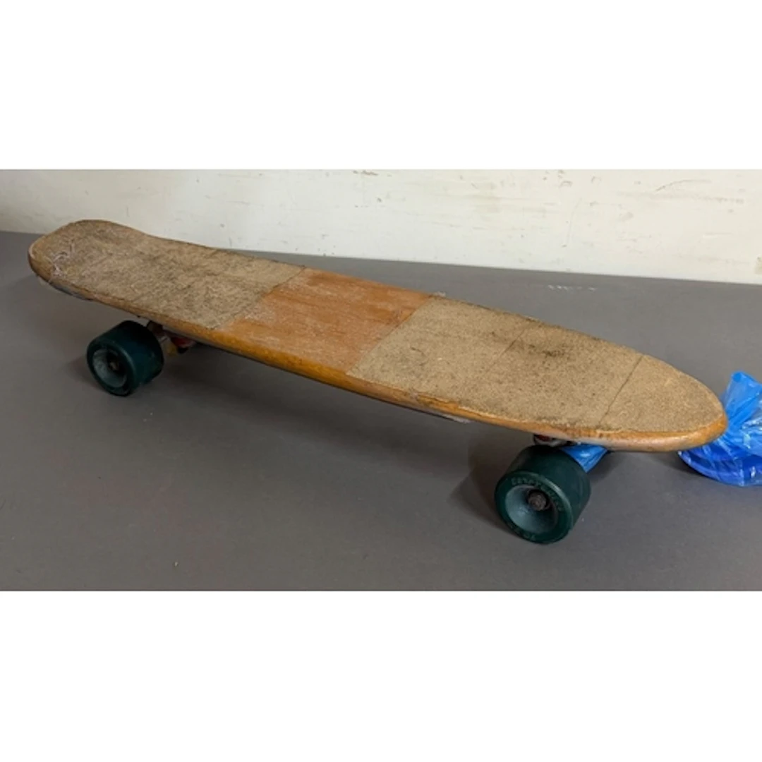 A Vintage skateboard featuring a Model T graphic