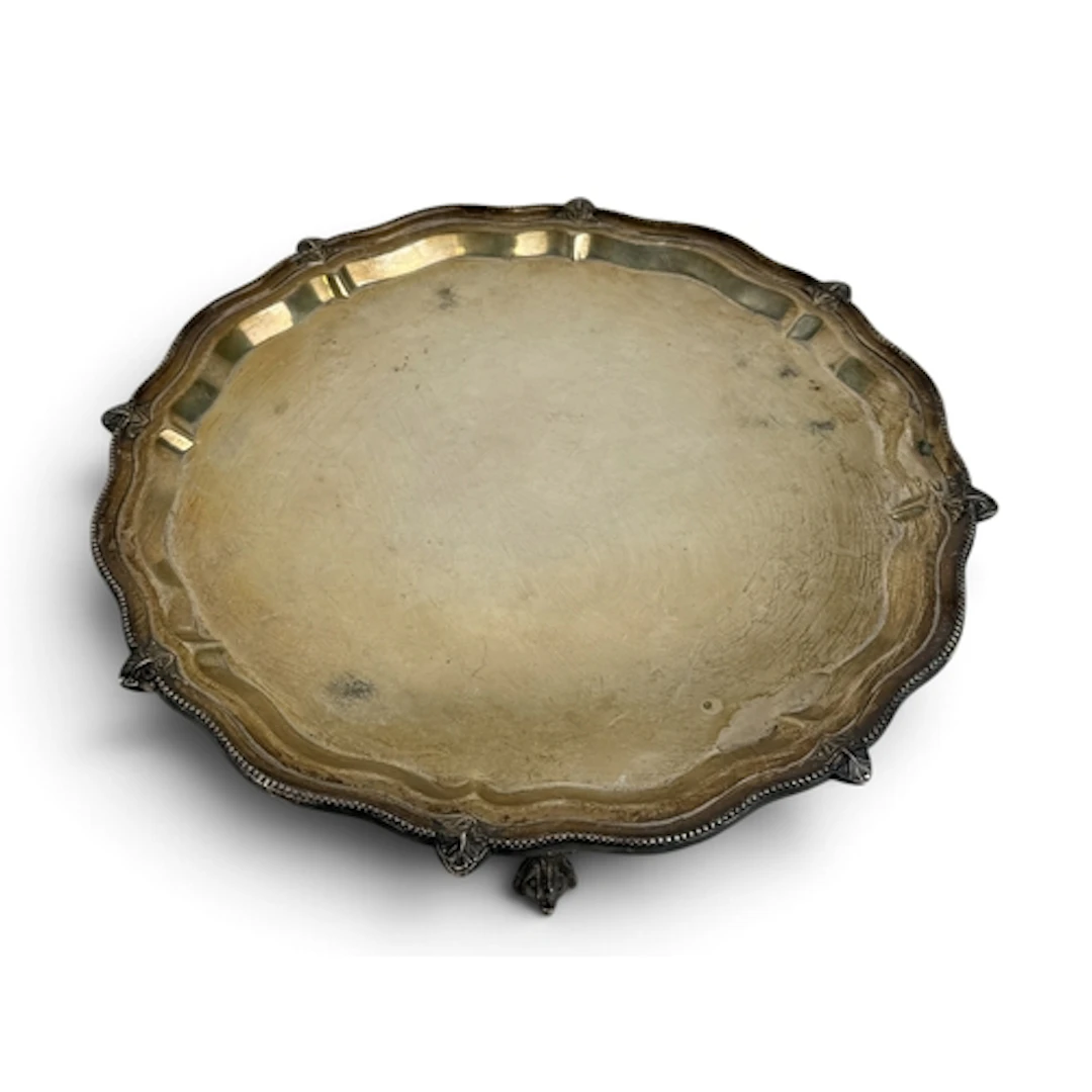 A GEORGE III STYLE SHAPED CIRCULAR SILVER SALVER, S BLACKENS...