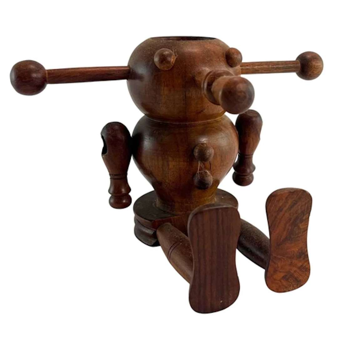 A wooden tureen / desk ornament in the form of a robot. A de...