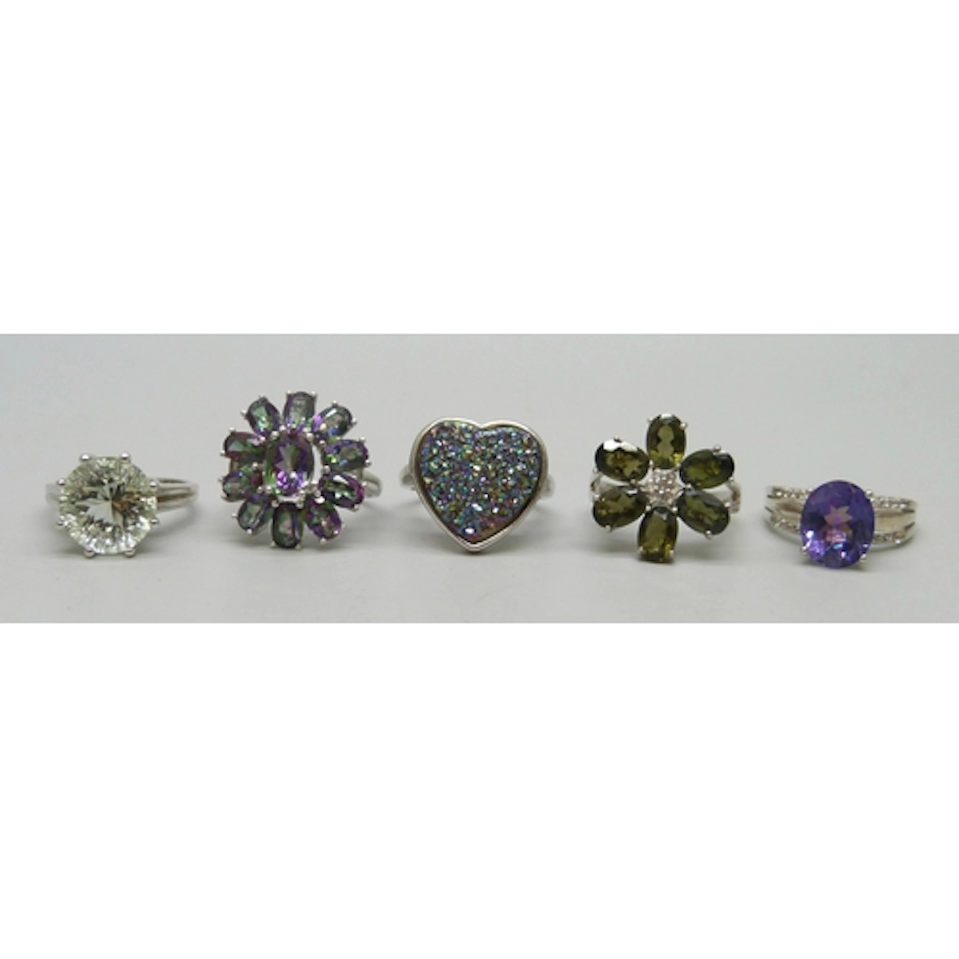 A collection of four silver TGGC and other gemstone rings, a...