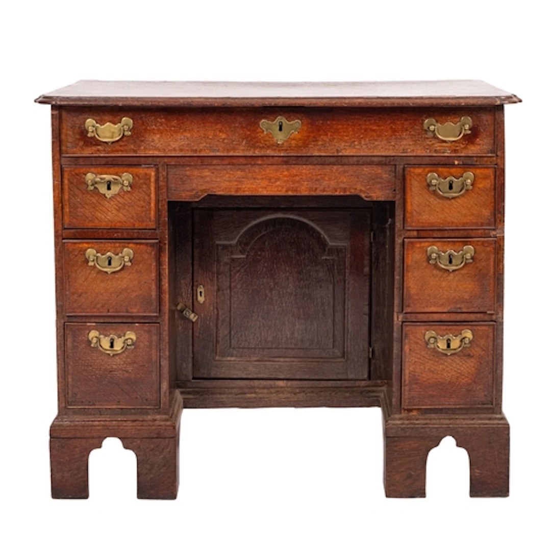 A George II oak and crossbanded kneehole desk , circa 1740; ...