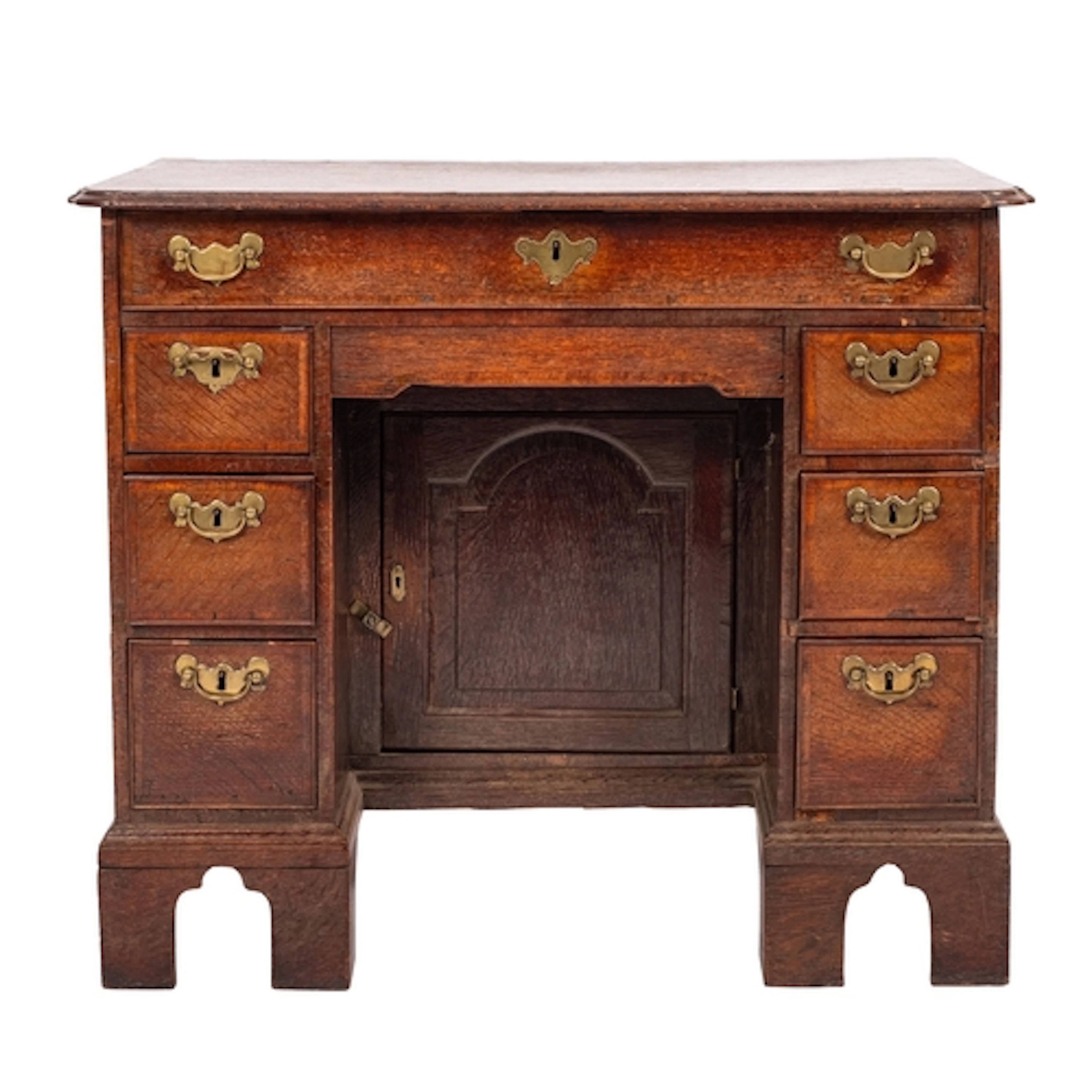 A George II oak and crossbanded kneehole desk , circa 1740; ...