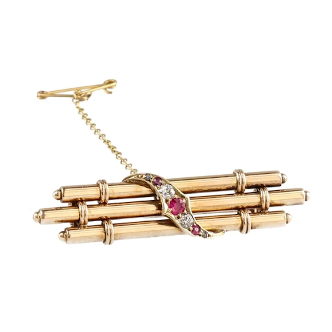 A LATE VICTORIAN 15 CARAT GOLD RUBY AND DIAMOND SET BAR BROO...