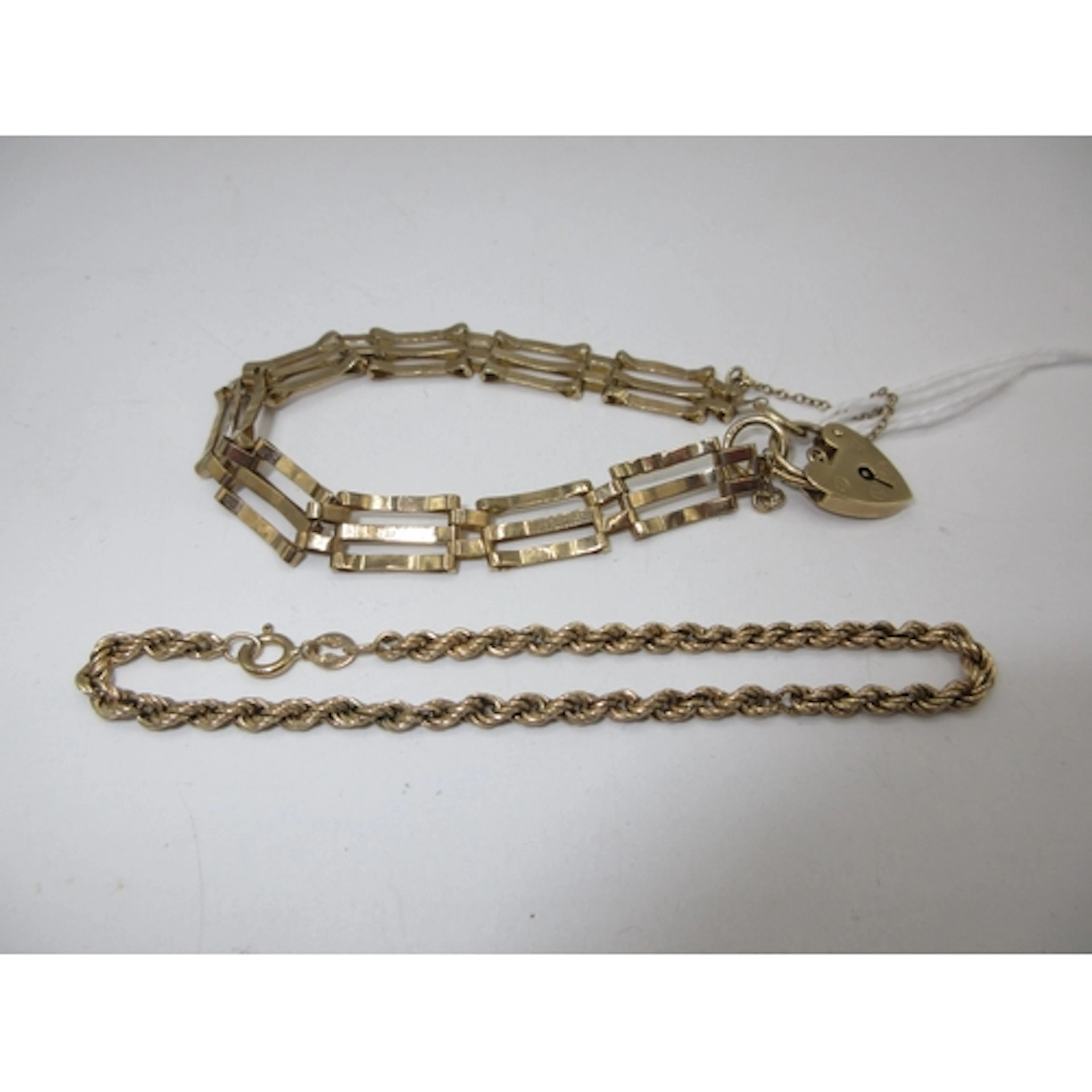 9ct Gold Gate Bracelet and 9ct Gold Rope Twist Bracelet, 9.2...