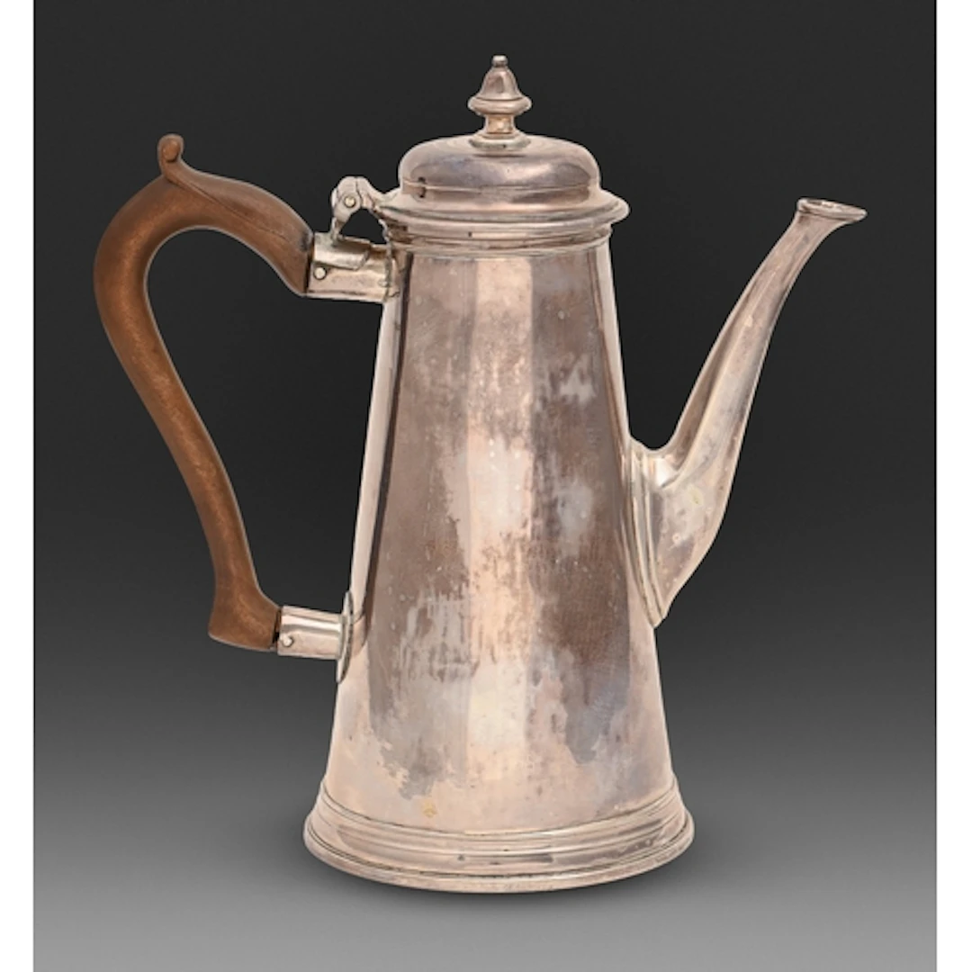 A George III silver coffee pot, with wrythen fluted bud fini...