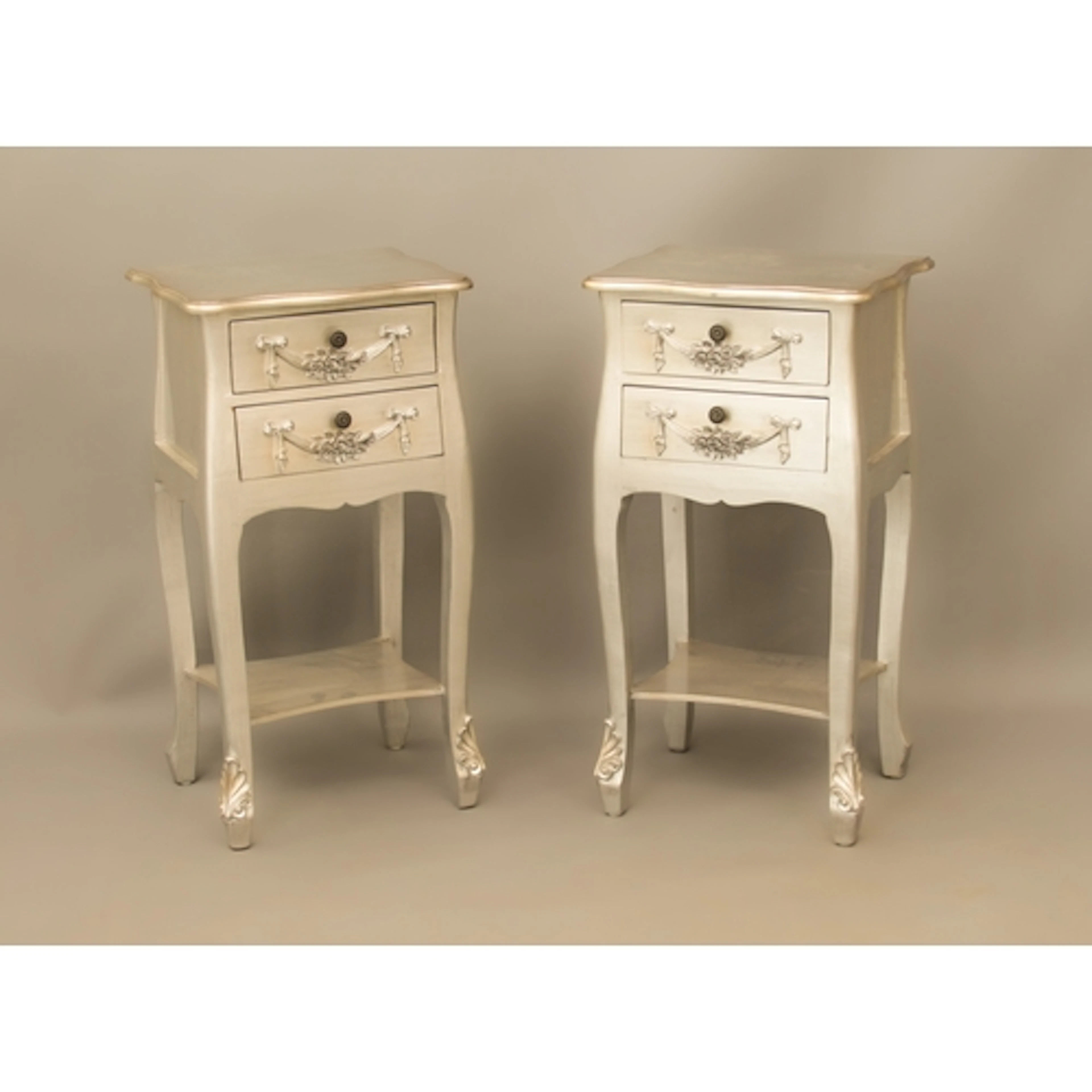 A pair of silver-painted bedside tables - in the 19th centur...
