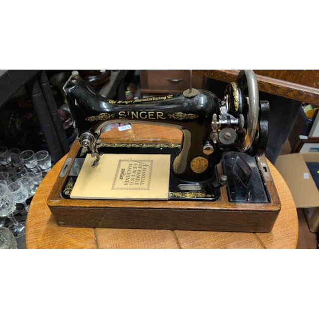 Singer sewing machine in black enamel with gilt floral decor...