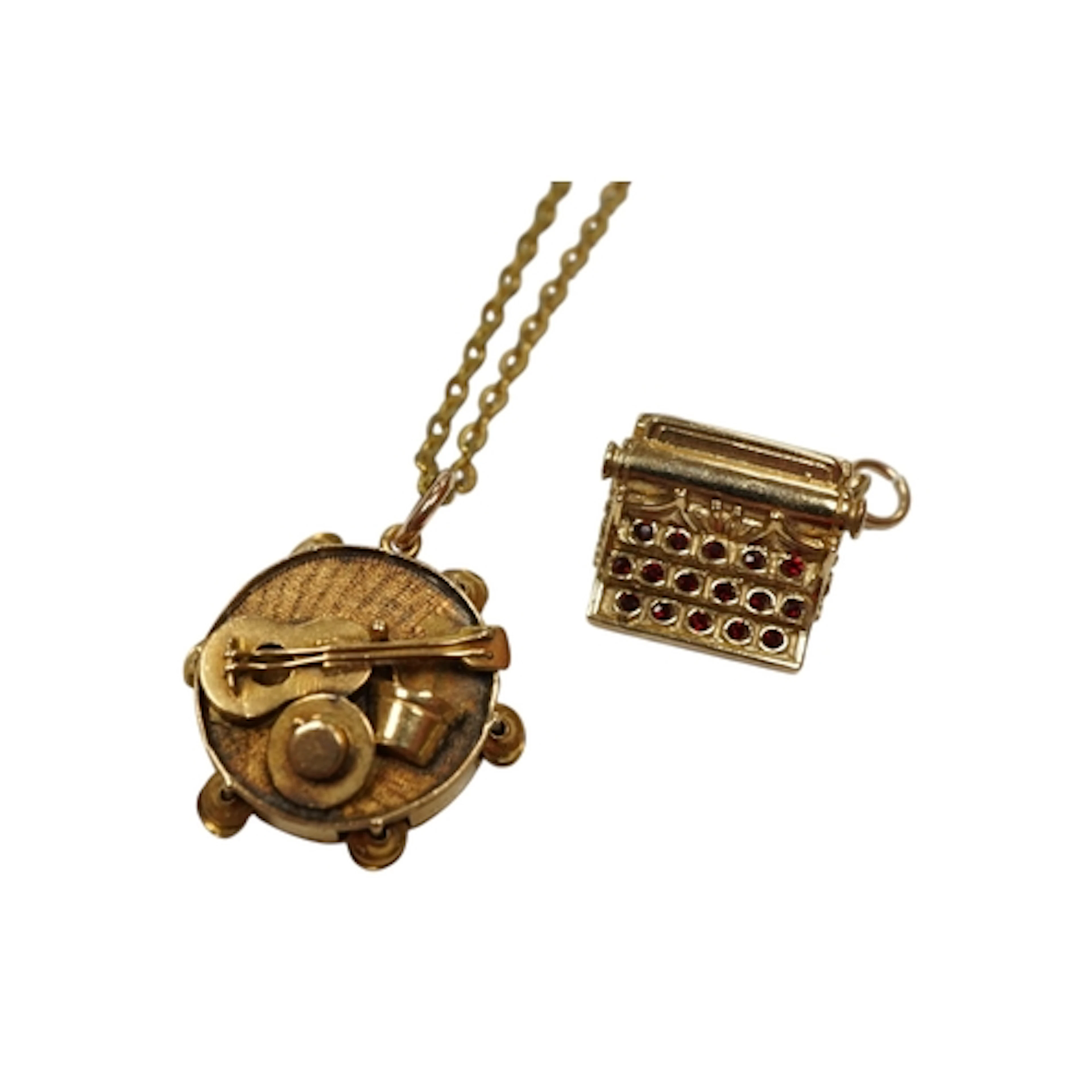 A 9ct gold typewriter charm, 11mm, together with an unmarked...