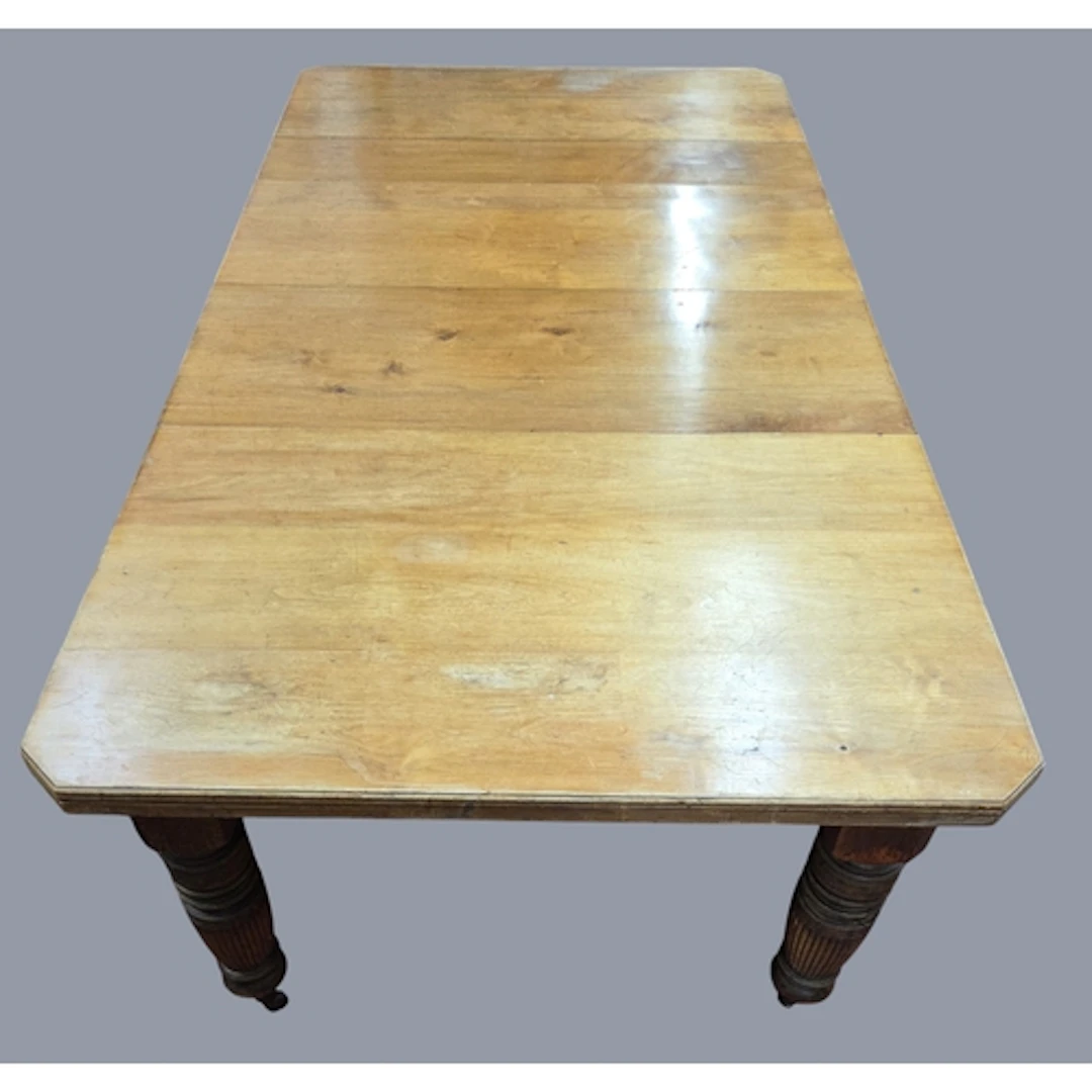 A good 19th Walnut two leaf Dining Table on turned fluted su...