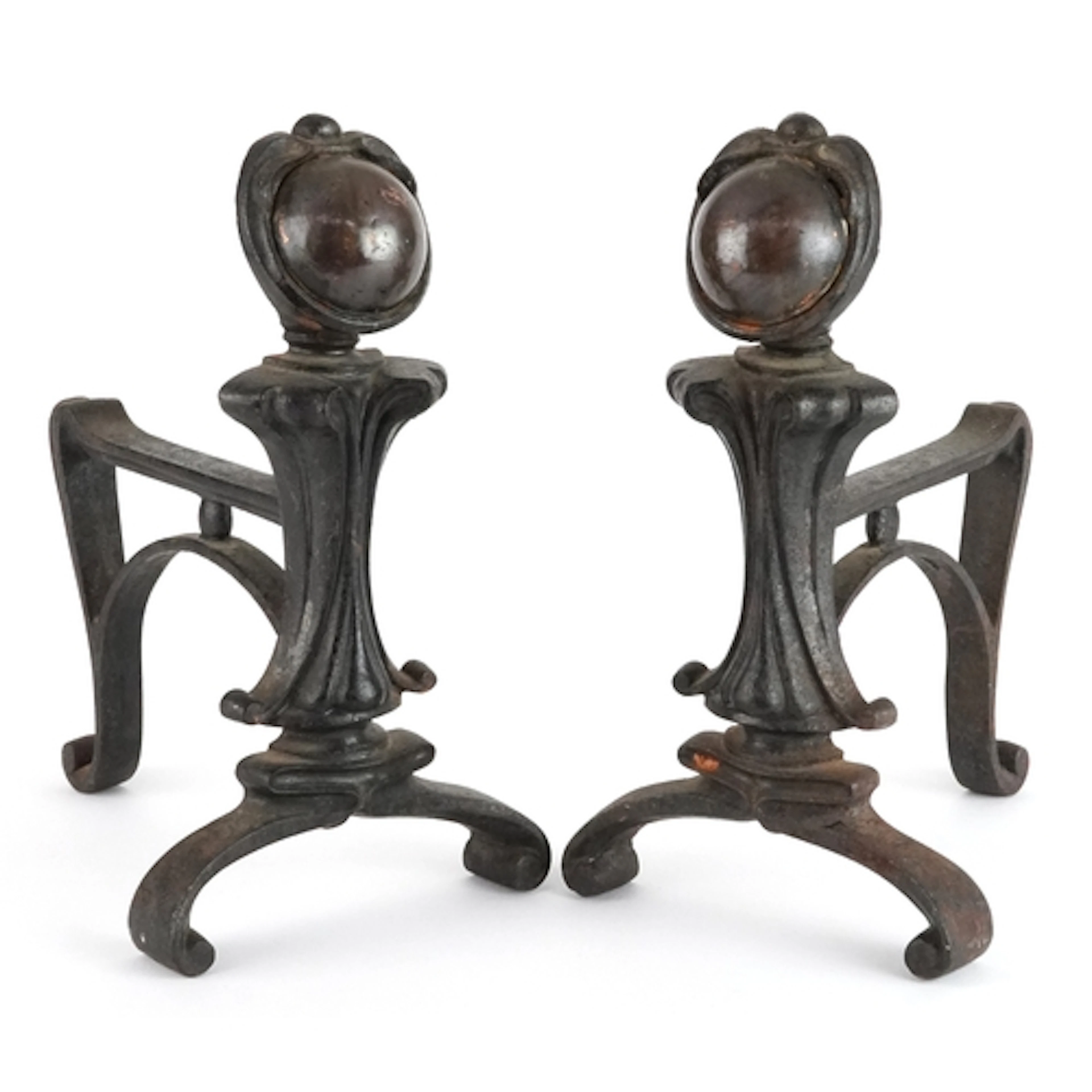 Pair of Arts & Crafts cast iron and copper fire dogs, regis...