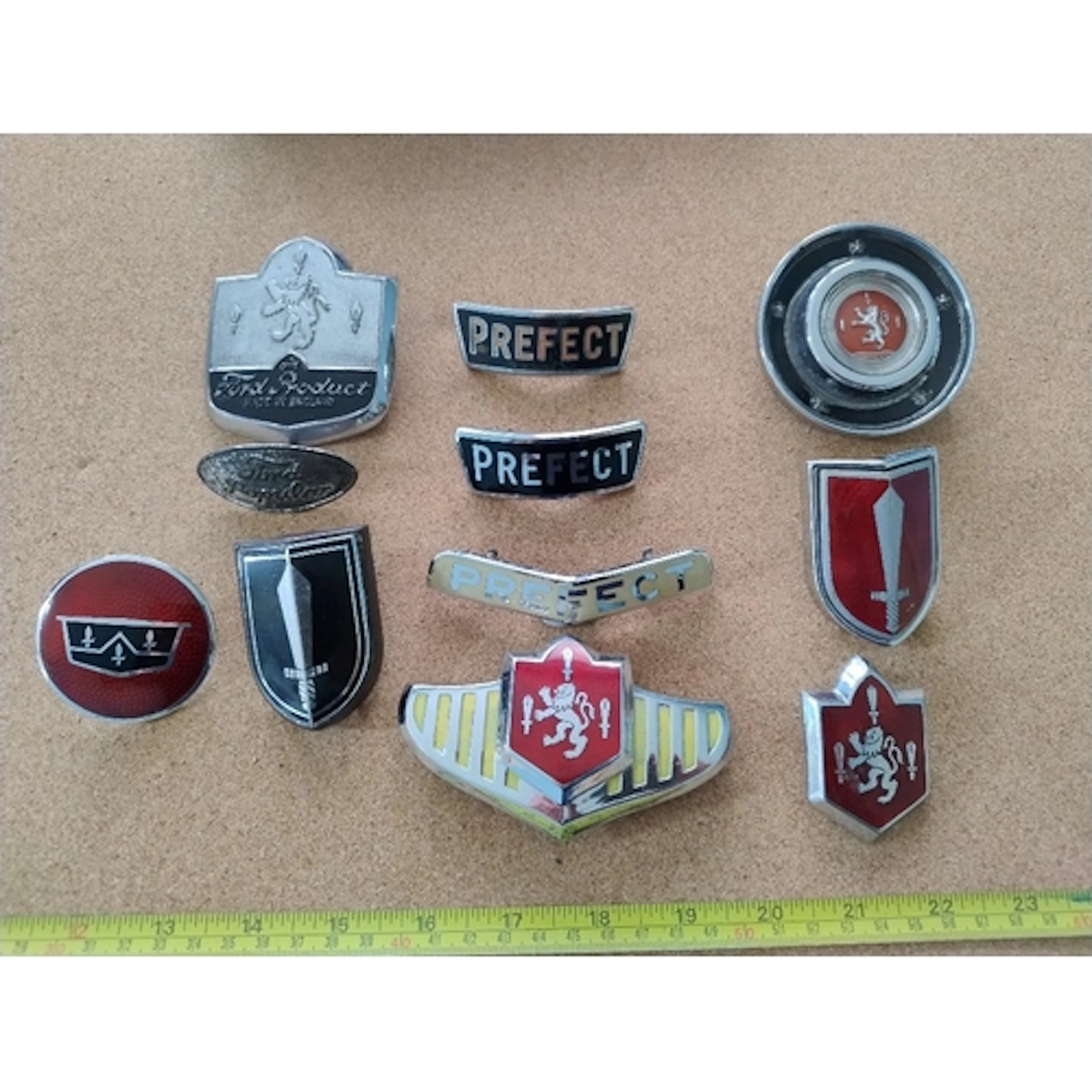 11 Ford car badges including Ford Perfect, Popular, Zephyr
