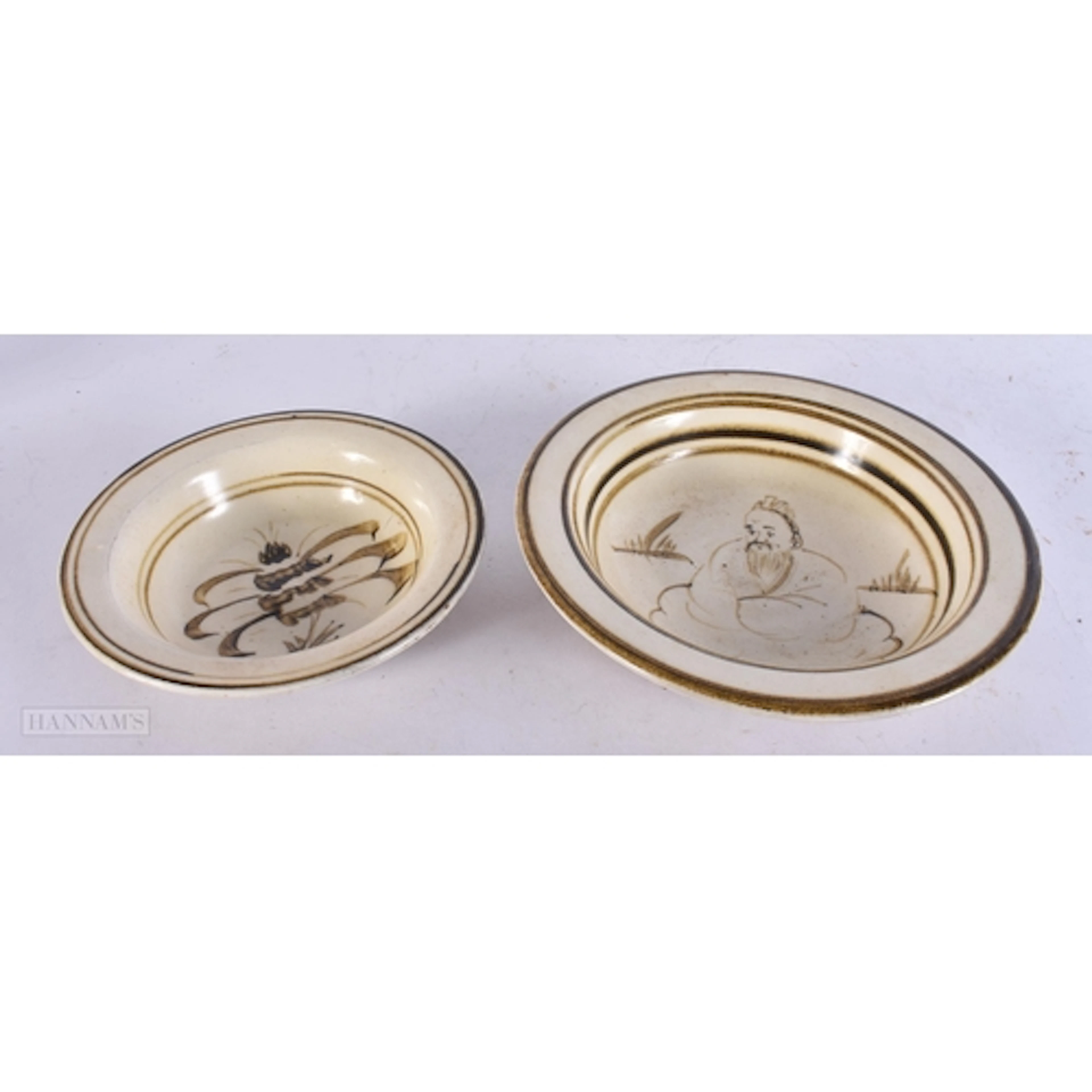 TWO CHINESE CIZHOU WARE BOWLS probably Yuan/Ming, one painte...