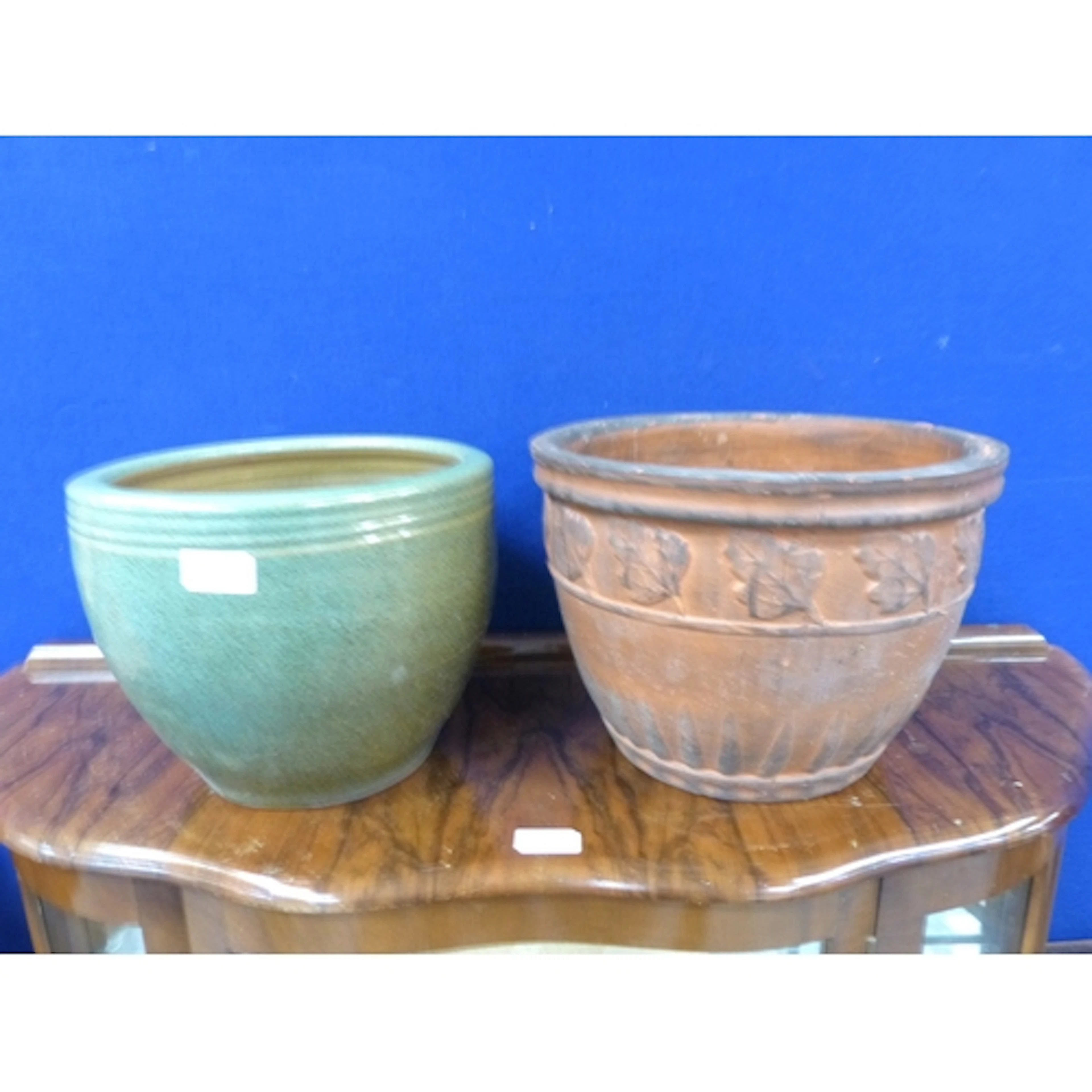 Two modern ceramic garden planters.