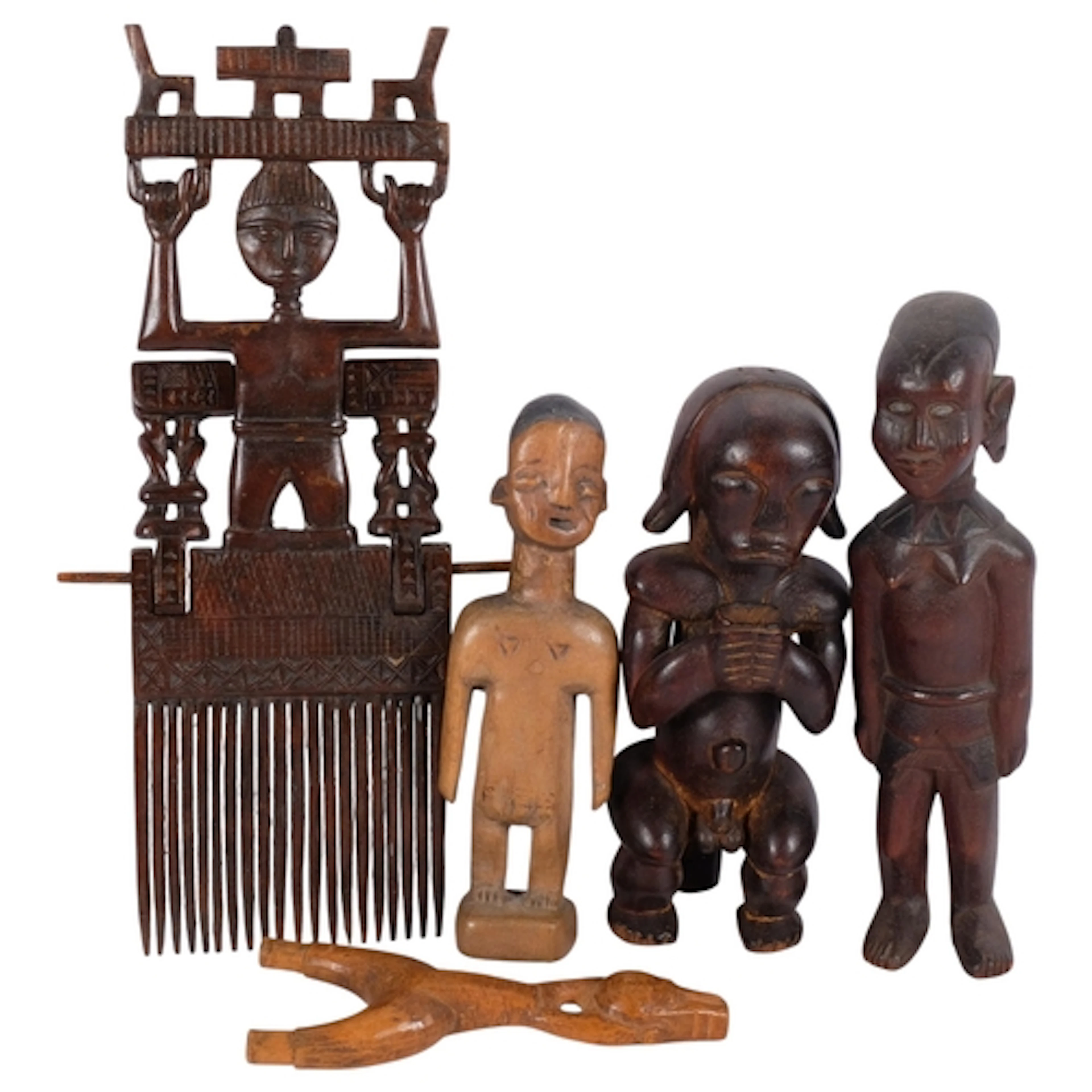 A group of African Tribal wood carvings, including an Ashant...