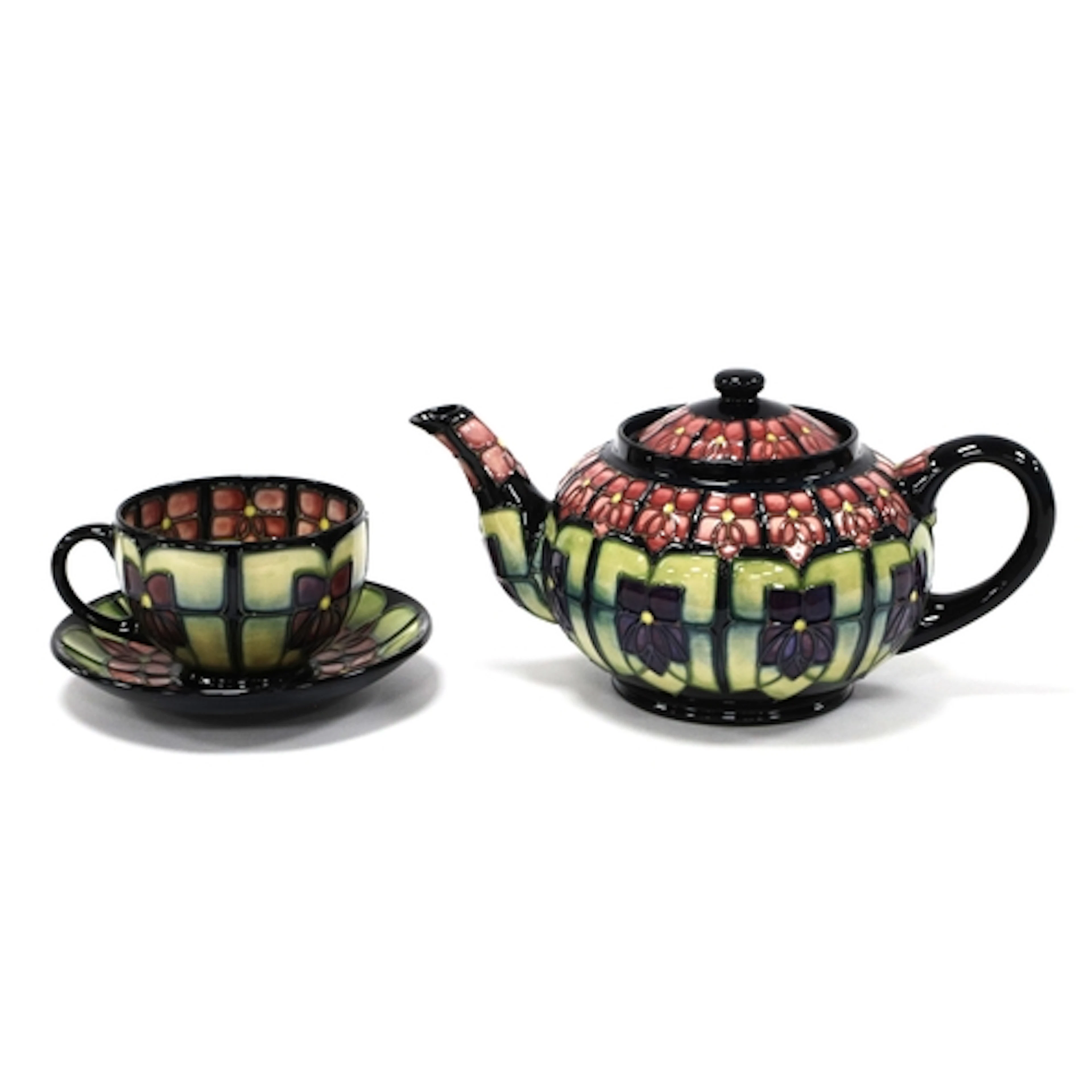 A Moorcroft Pottery Teapot and Cover, of globular form, pain...