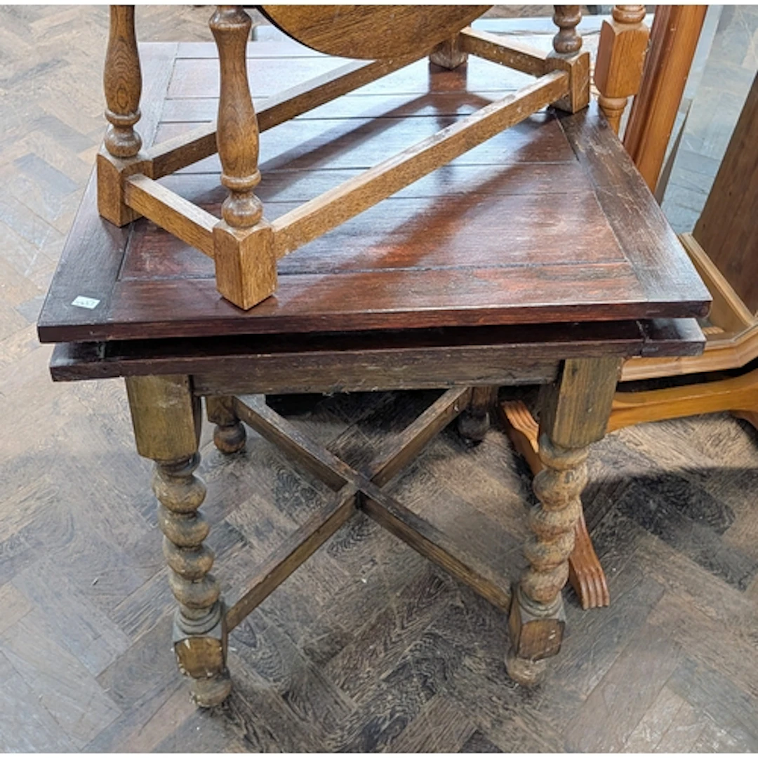 A small square oak drawer leaf table standing on barley twis...