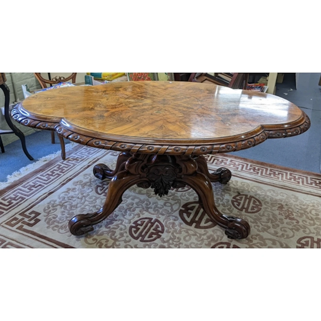 A Victorian burr walnut loo table having a quarter cut venee...
