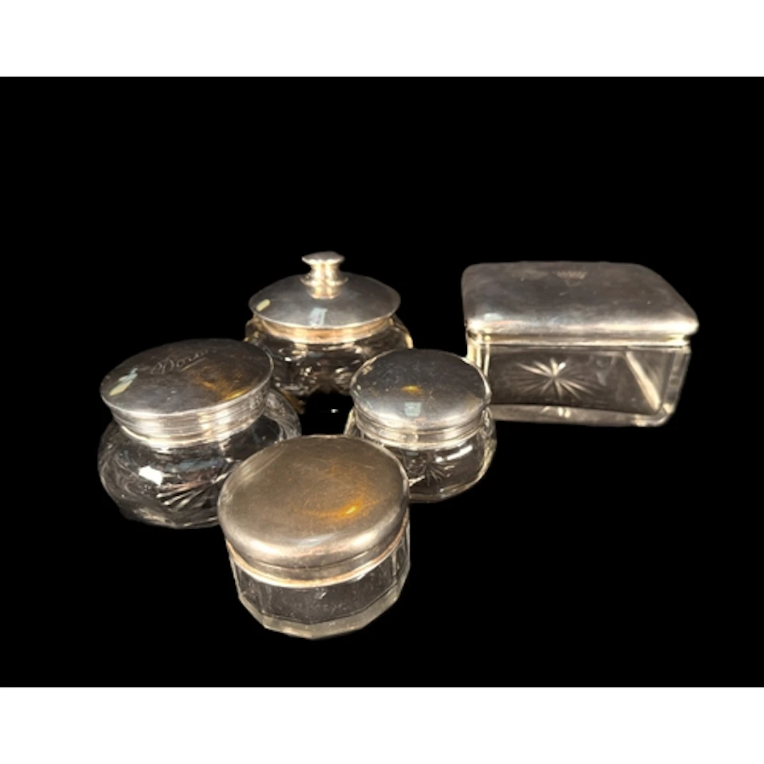 Three hall marked silver topped glass powder pots, a Dutch s...