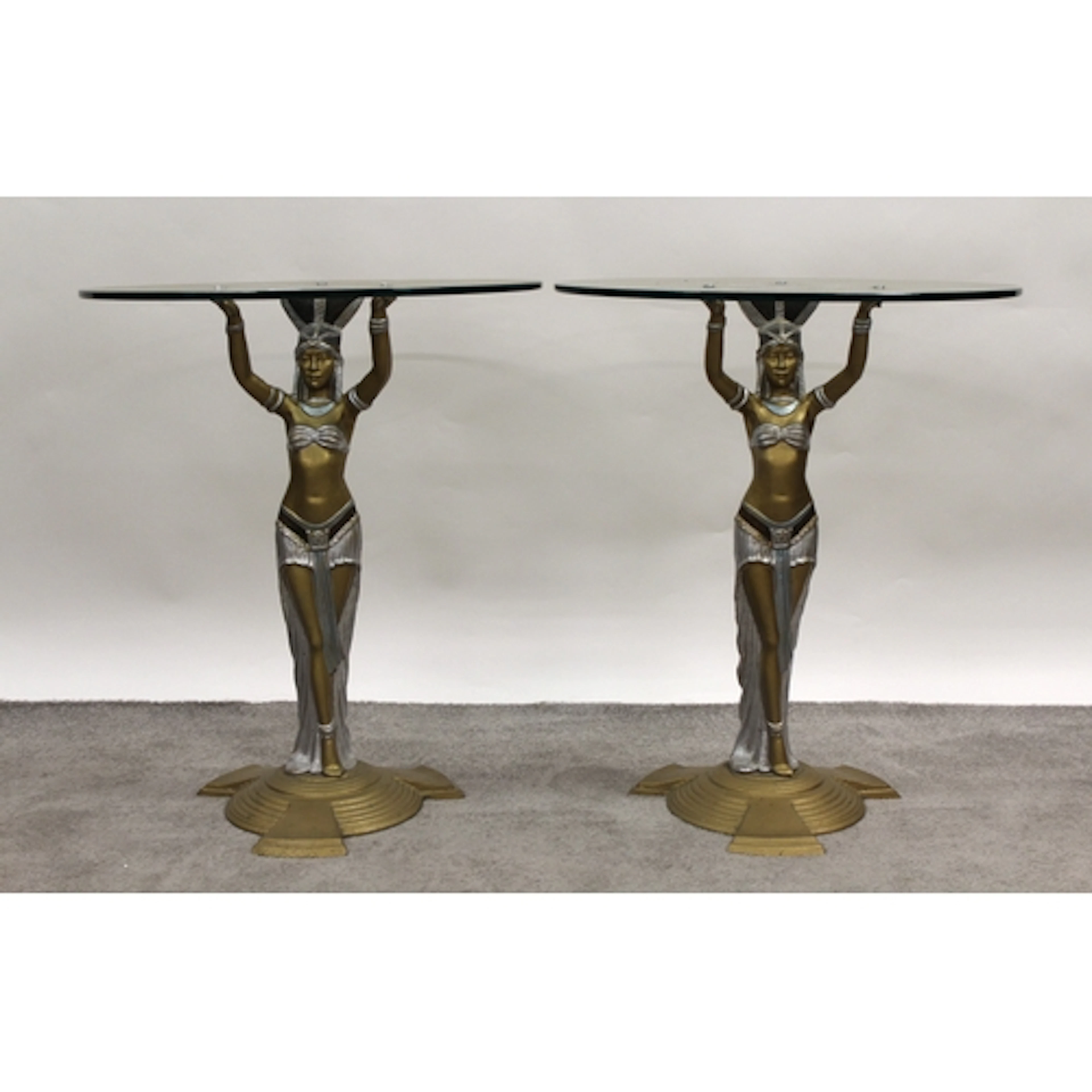 Pair of Art Deco painted cast iron and glass pedestal tables...