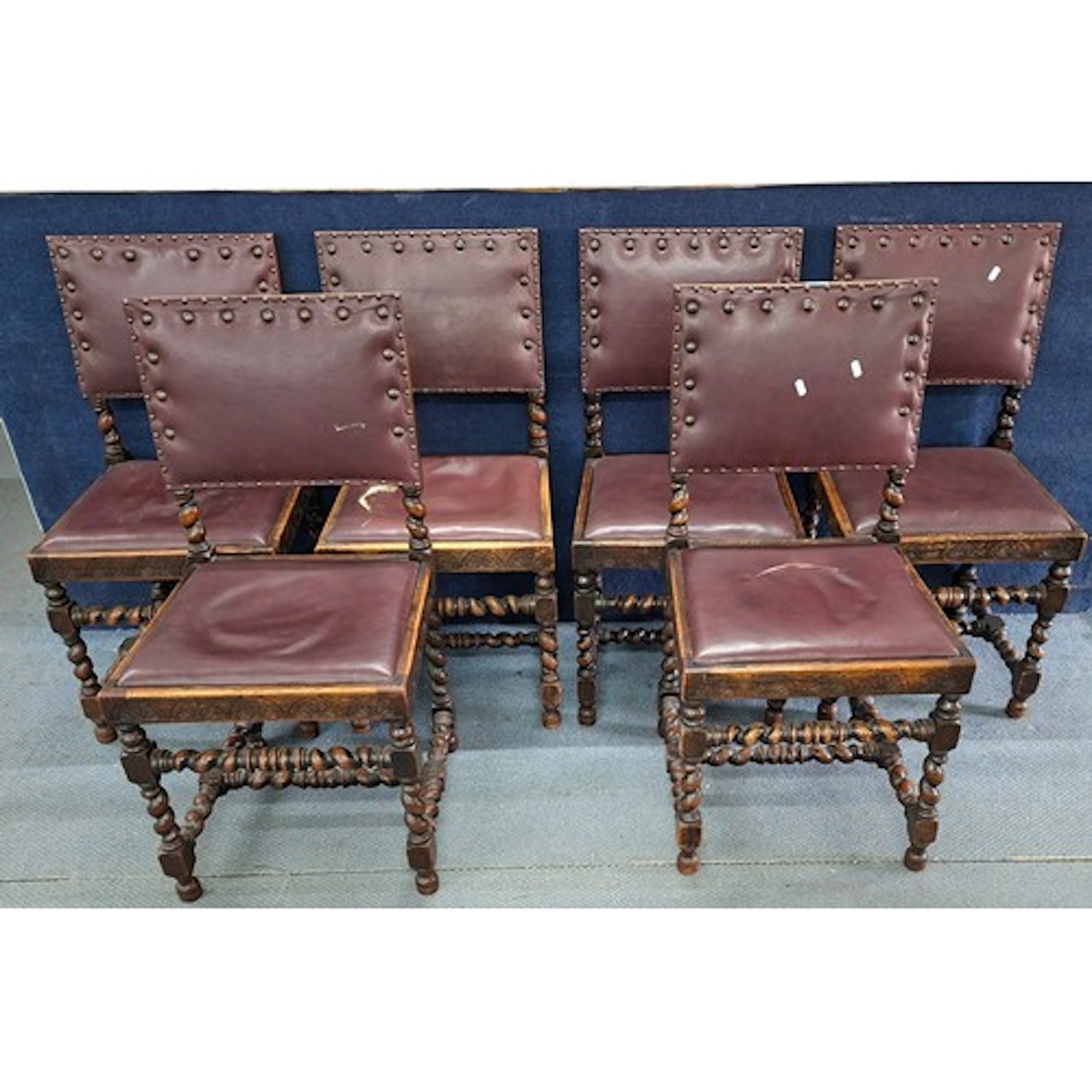 A set of 6 carved 1920's oak Baronial style dining chairs ha...