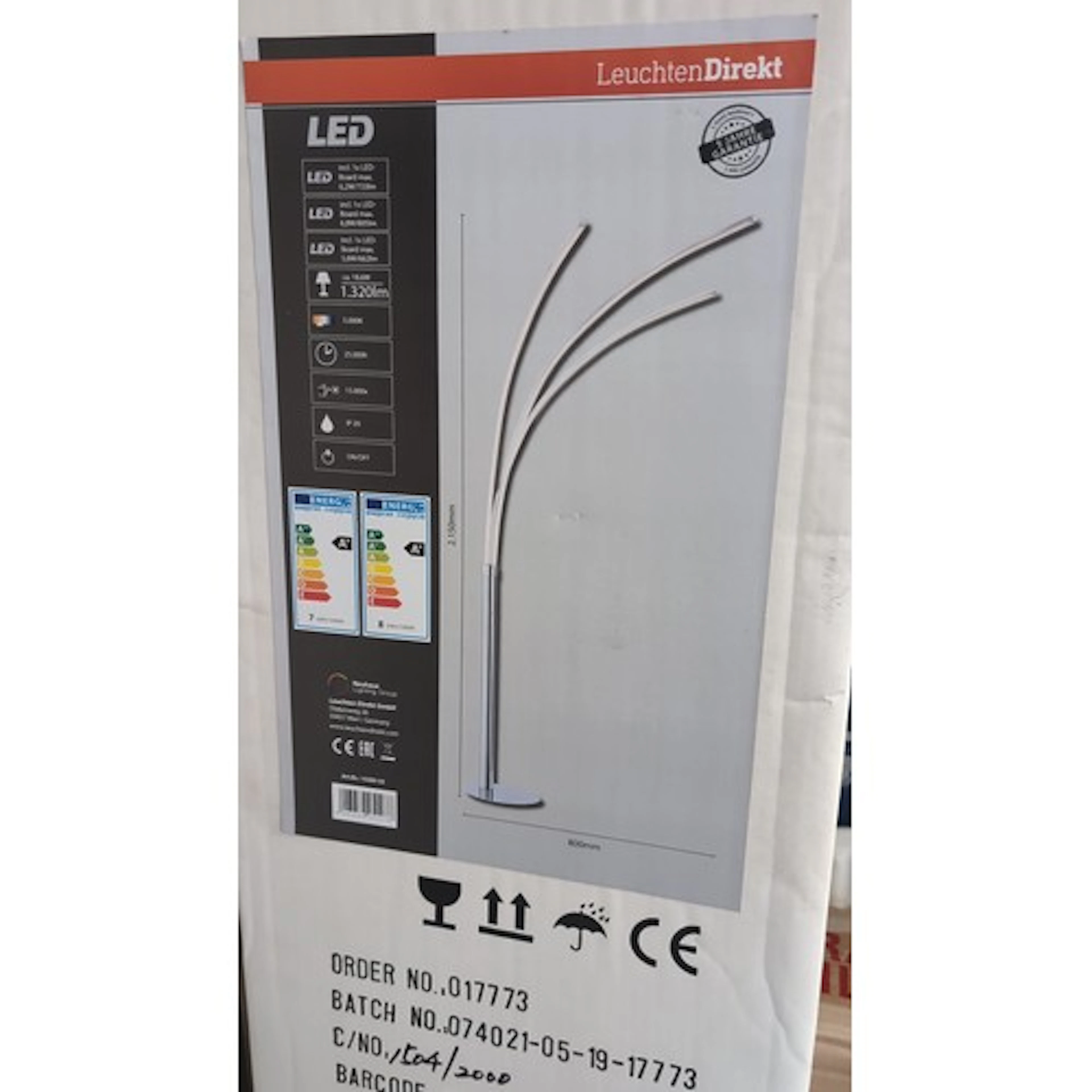 LeuchtenDirekt LED floor lamp, the arched tri-light design i...