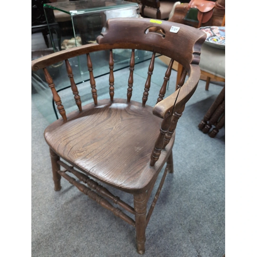 Elm seated captains chair. Split to arm.