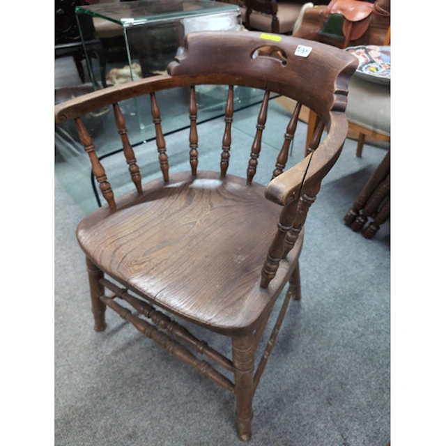 Elm seated captains chair. Split to arm.