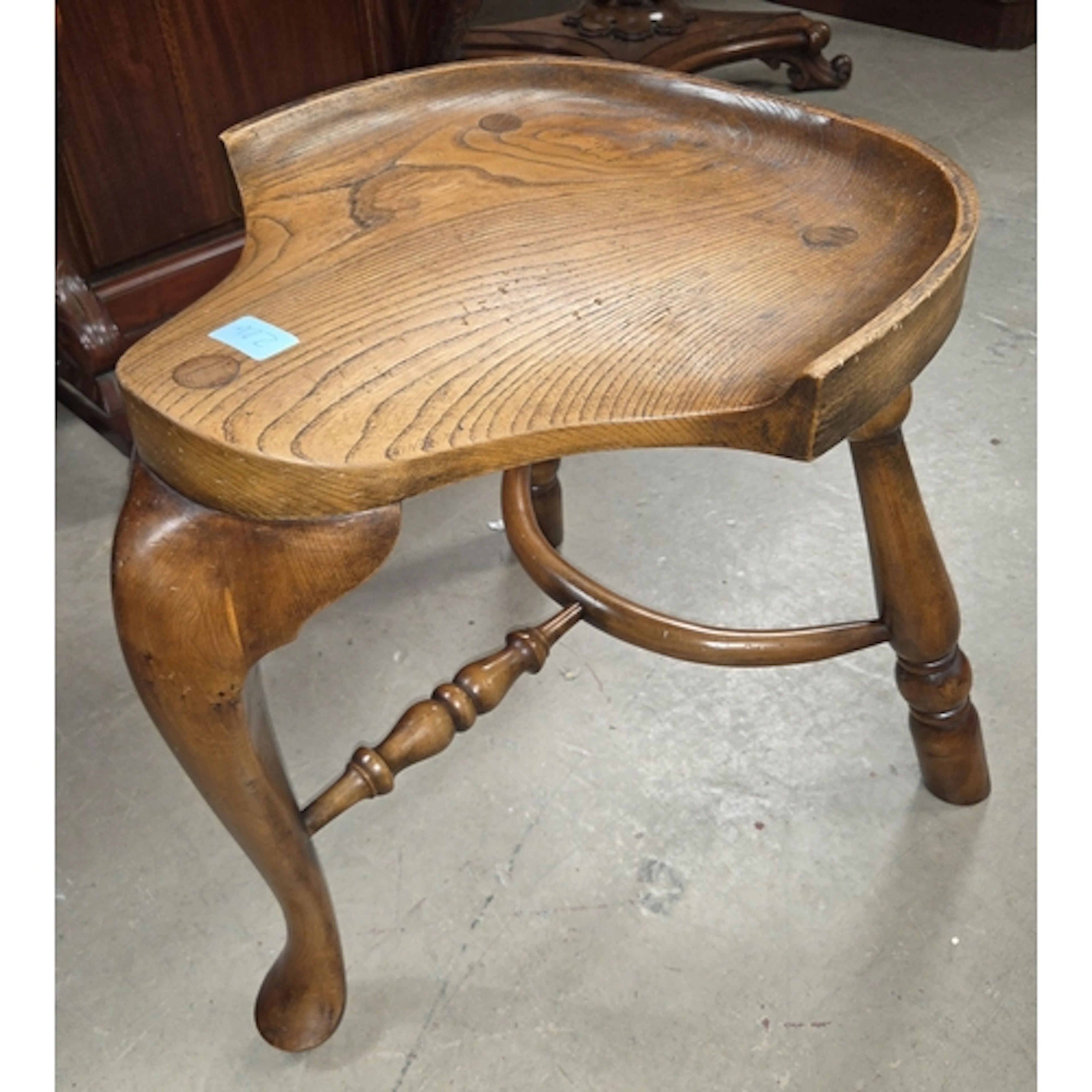 A 19th century cock fighting stool, 3 legged with solid sadd...