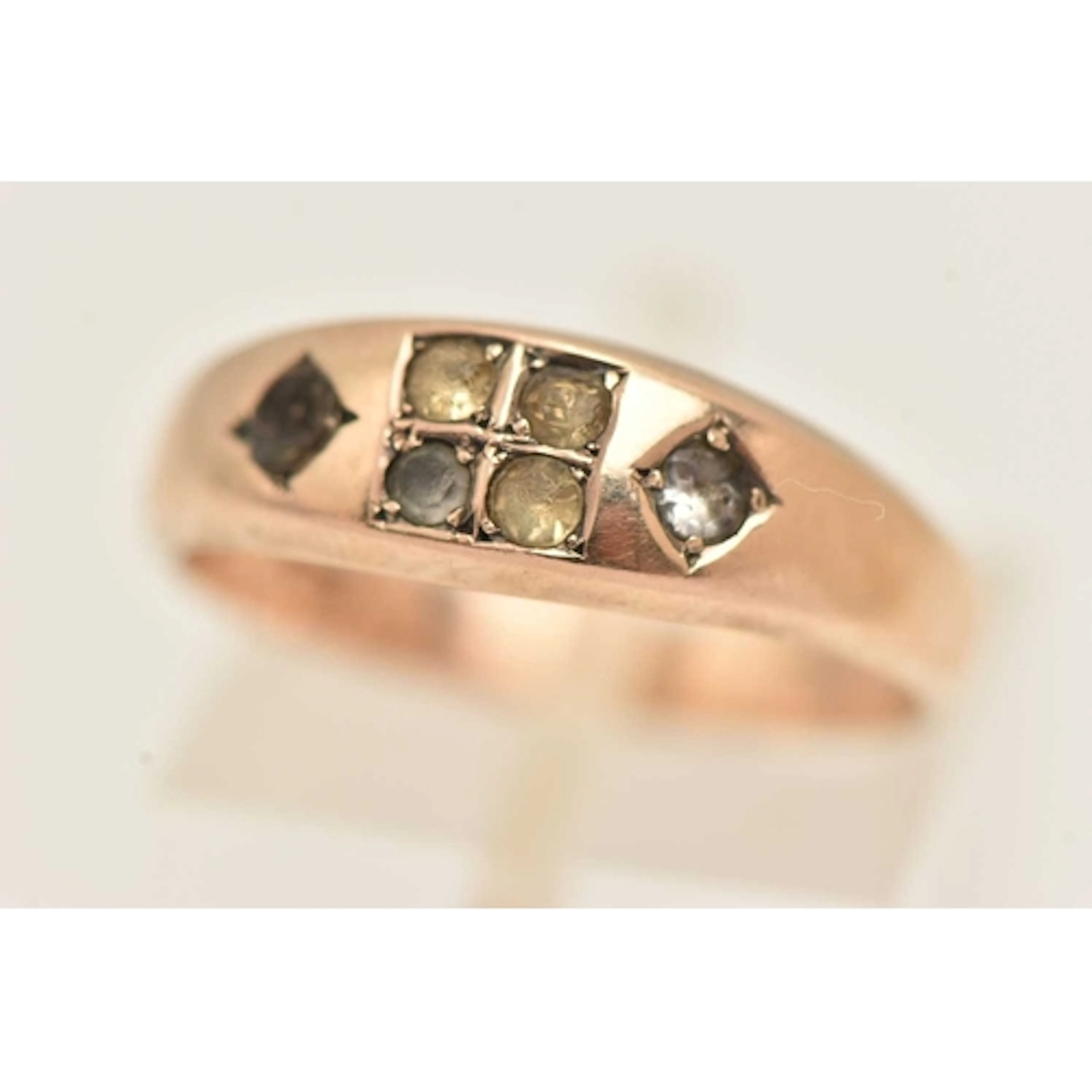 A 9CT GOLD PASTE SET RING, AF missing stone, set with other ...
